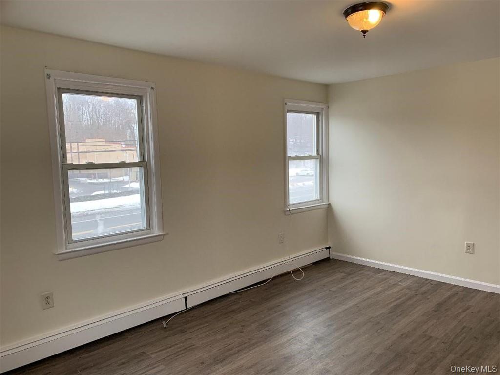 5273 Rte 9W, Unit NORTH Newburgh, NY 12550 - Photo 7 of 21 an empty room with wooden floor and windows