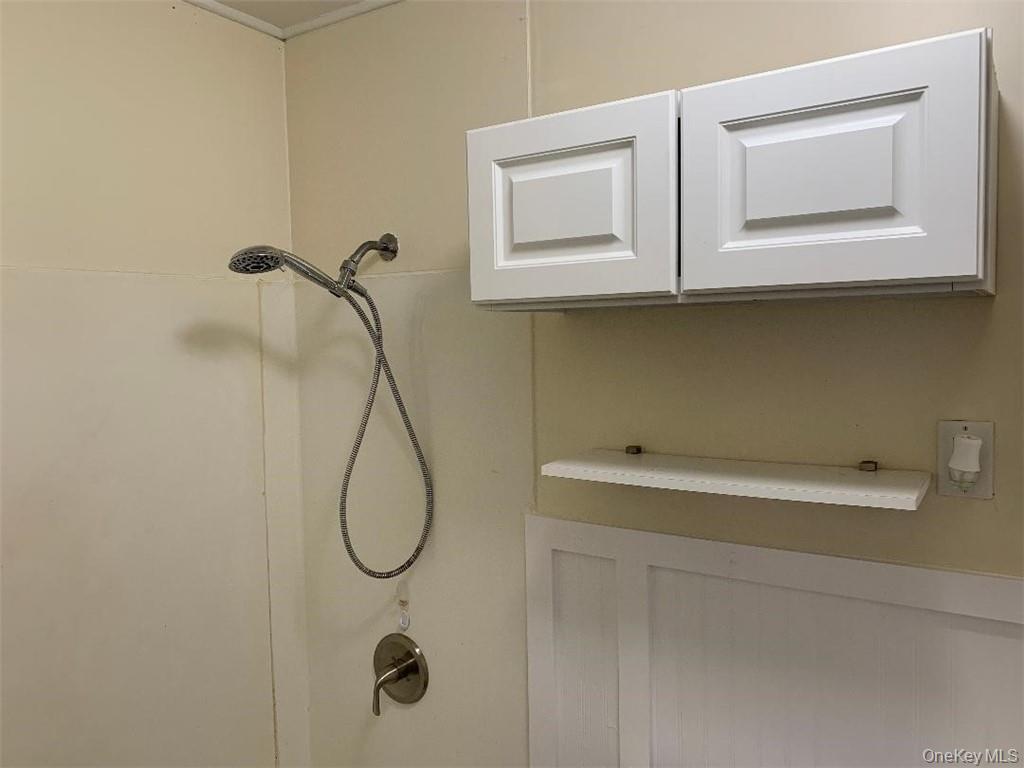 5273 Rte 9W, Unit NORTH Newburgh, NY 12550 - Photo 10 of 21 a bathroom with a sink and mirror