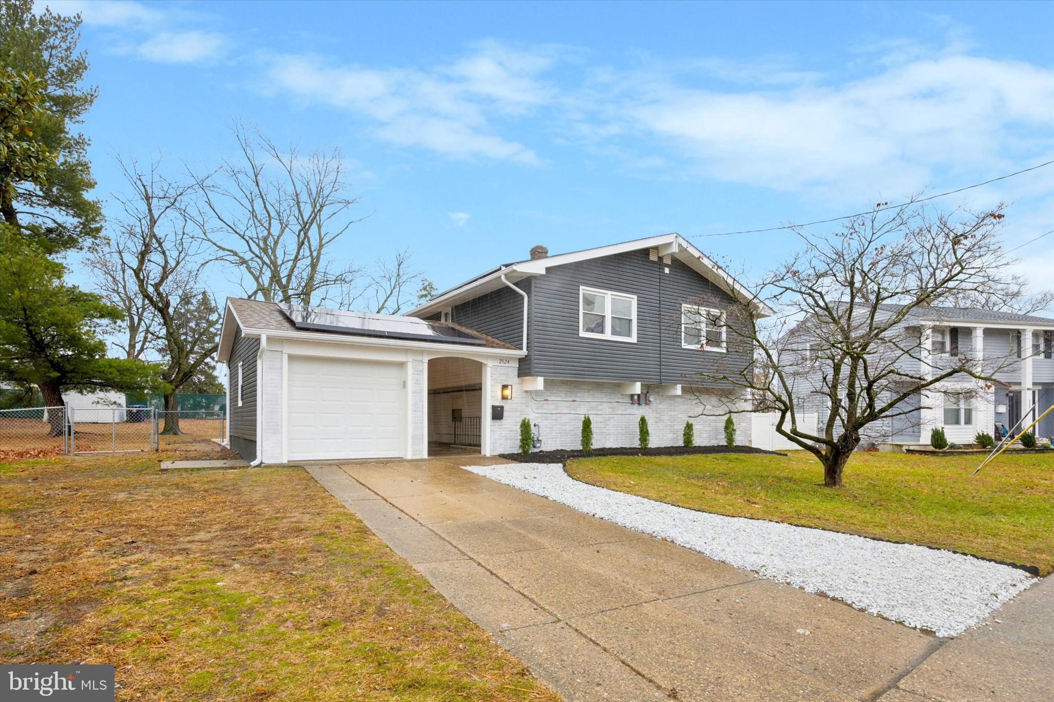2124 Arleigh Road Cinnaminson, NJ 08077 - Photo 1 of 31 a front view of house with yard and trees around