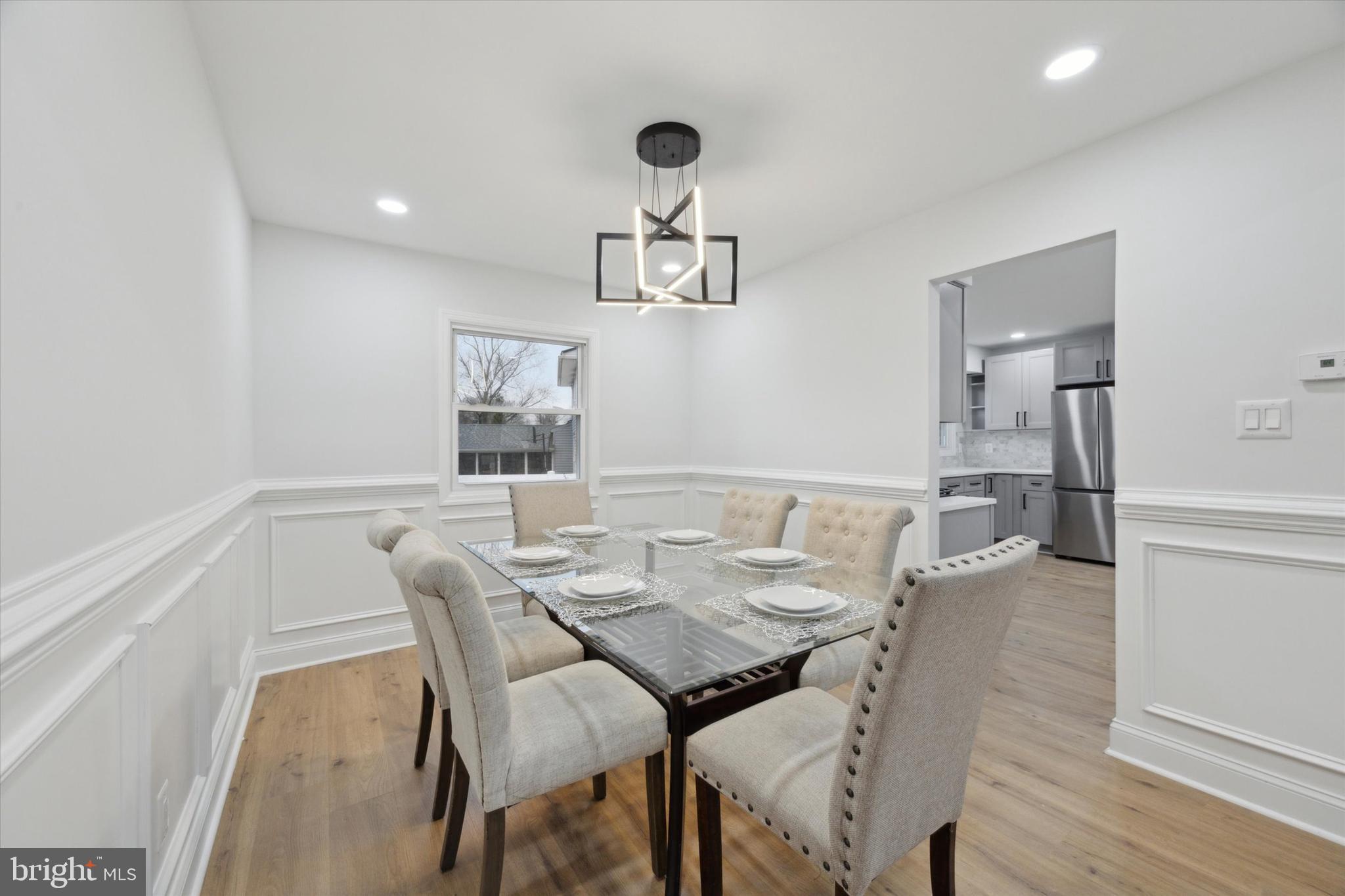 2124 Arleigh Road Cinnaminson, NJ 08077 - Photo 11 of 31 a view of a dining room with furniture and wooden floor