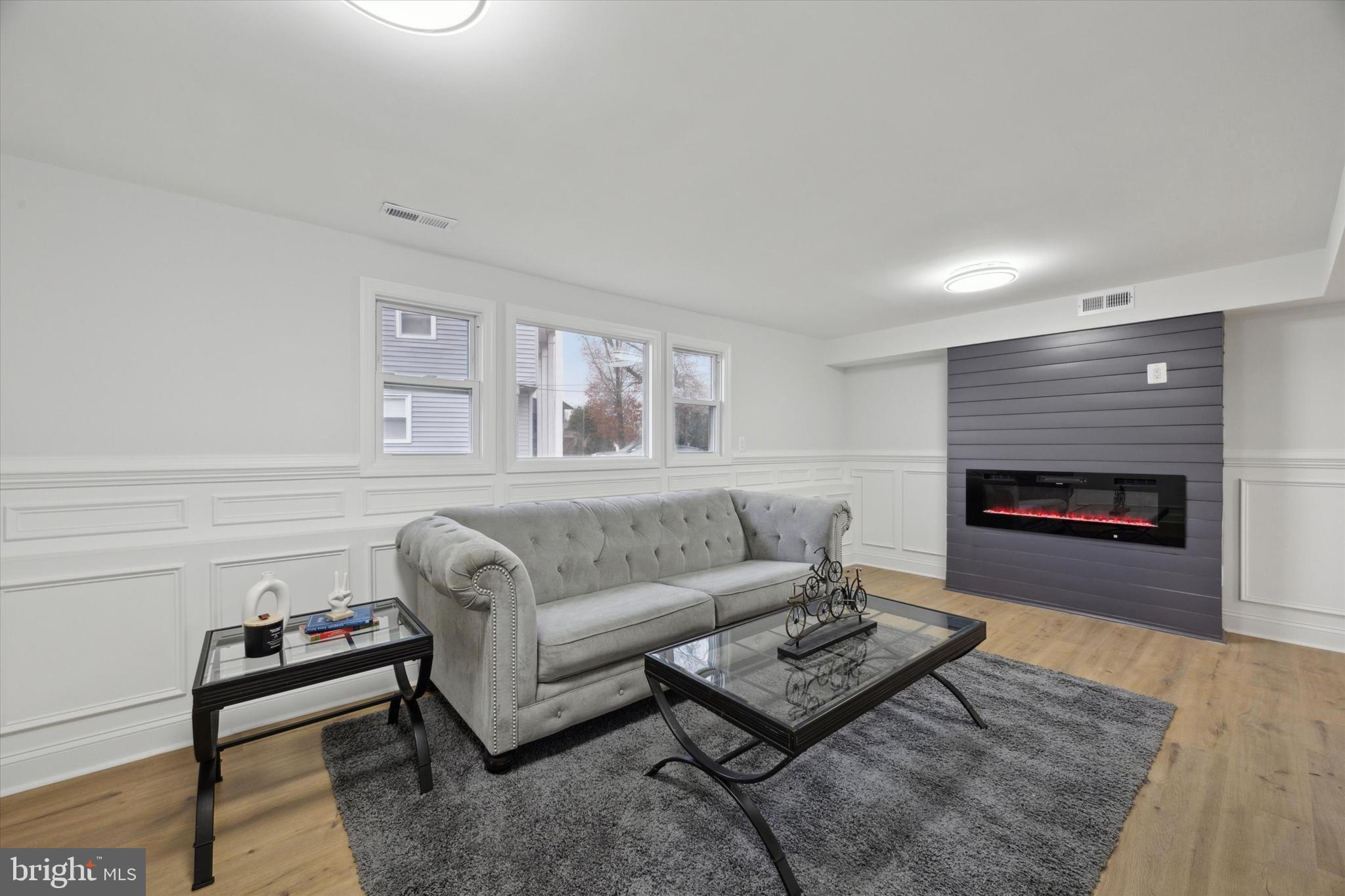 2124 Arleigh Road Cinnaminson, NJ 08077 - Photo 13 of 31 a living room with furniture and a fireplace