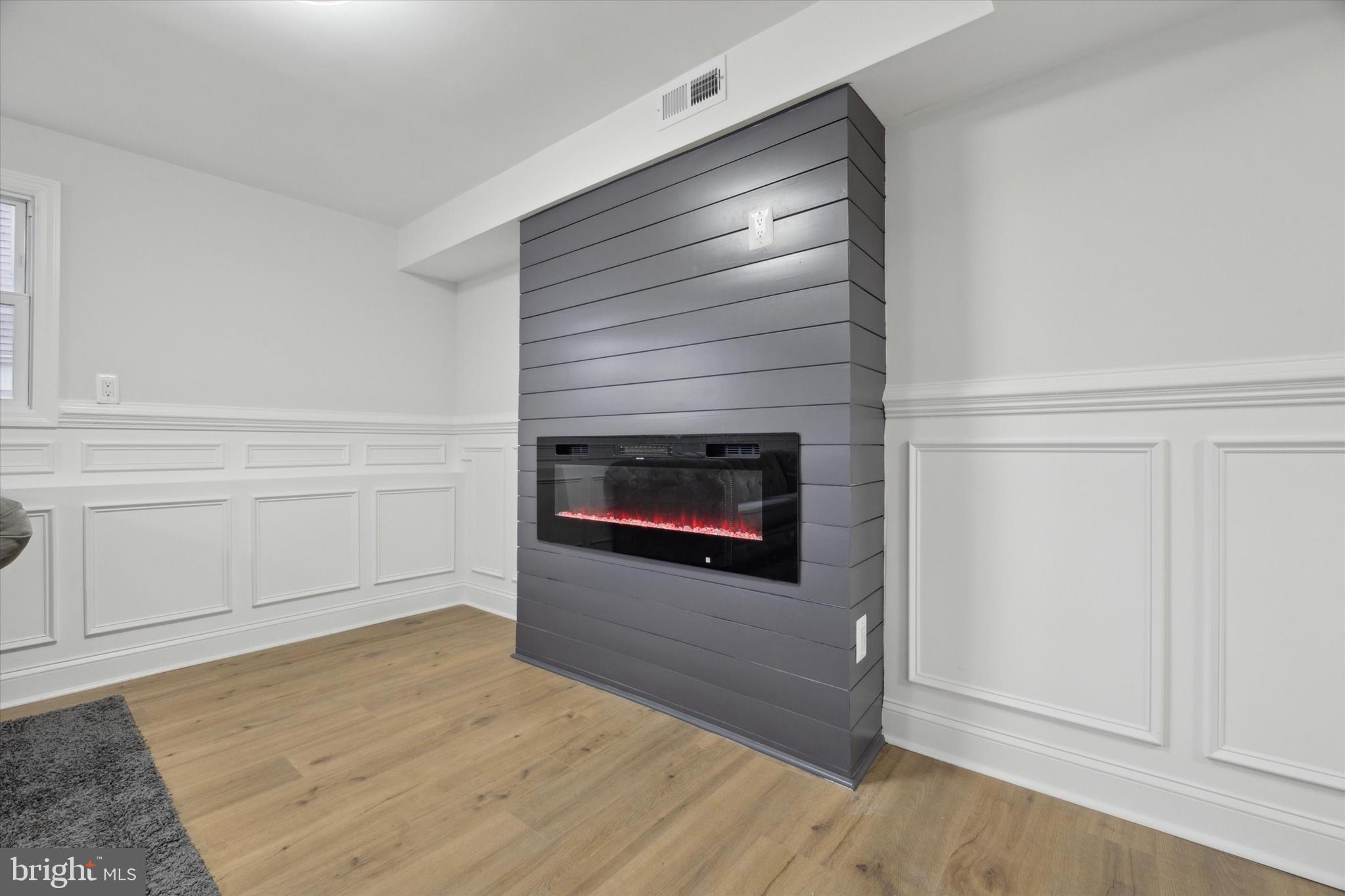 2124 Arleigh Road Cinnaminson, NJ 08077 - Photo 14 of 31 a living room with a fireplace and a rug
