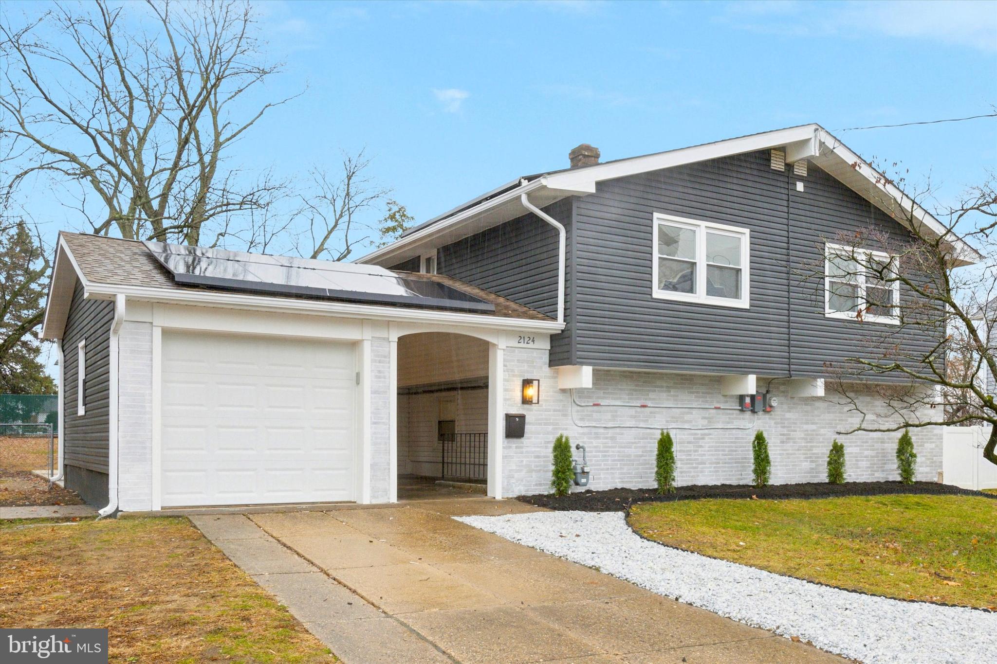 2124 Arleigh Road Cinnaminson, NJ 08077 - Photo 2 of 31 a view of a house with a yard and garage