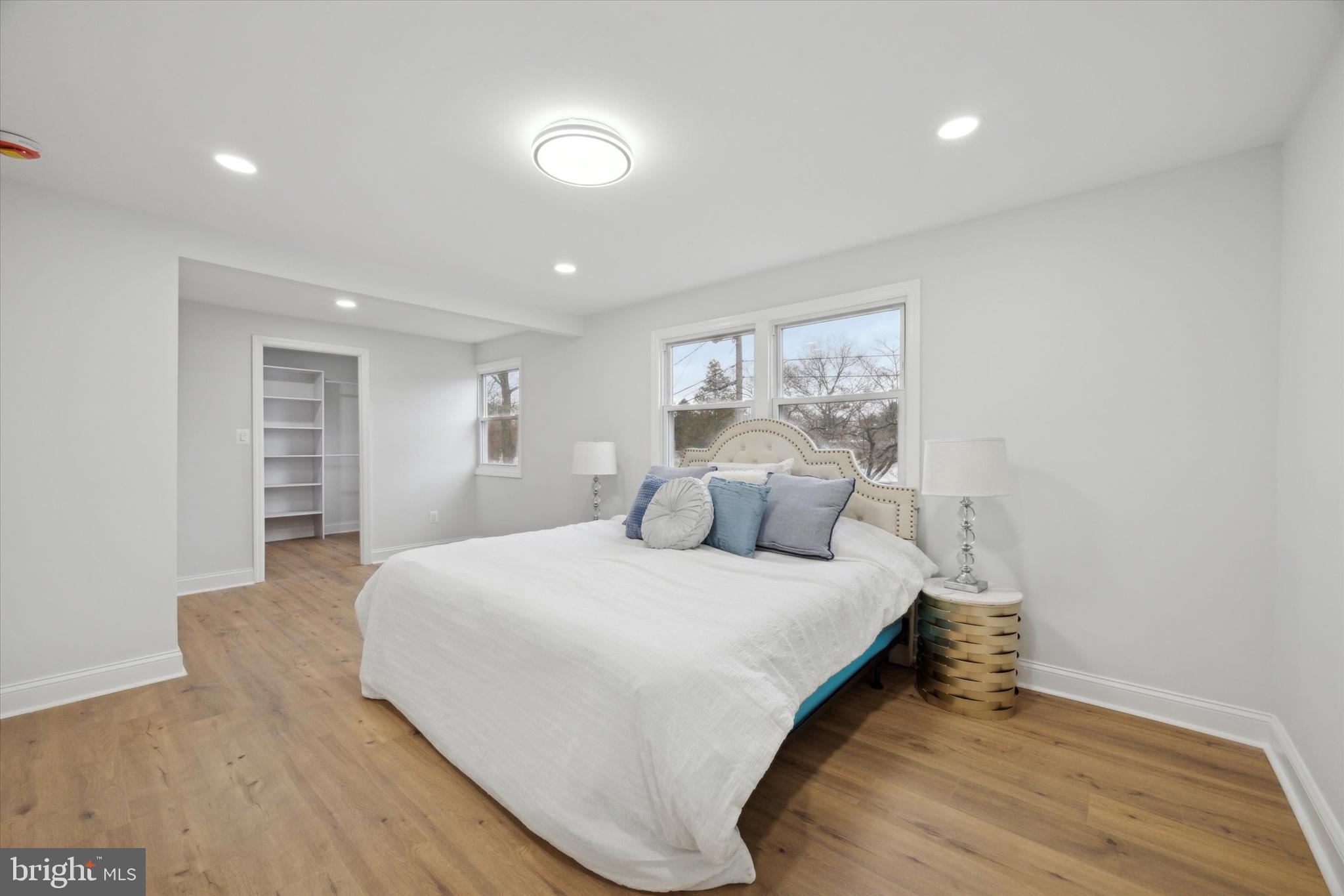 2124 Arleigh Road Cinnaminson, NJ 08077 - Photo 22 of 31 a bedroom with a large bed and a wooden floor