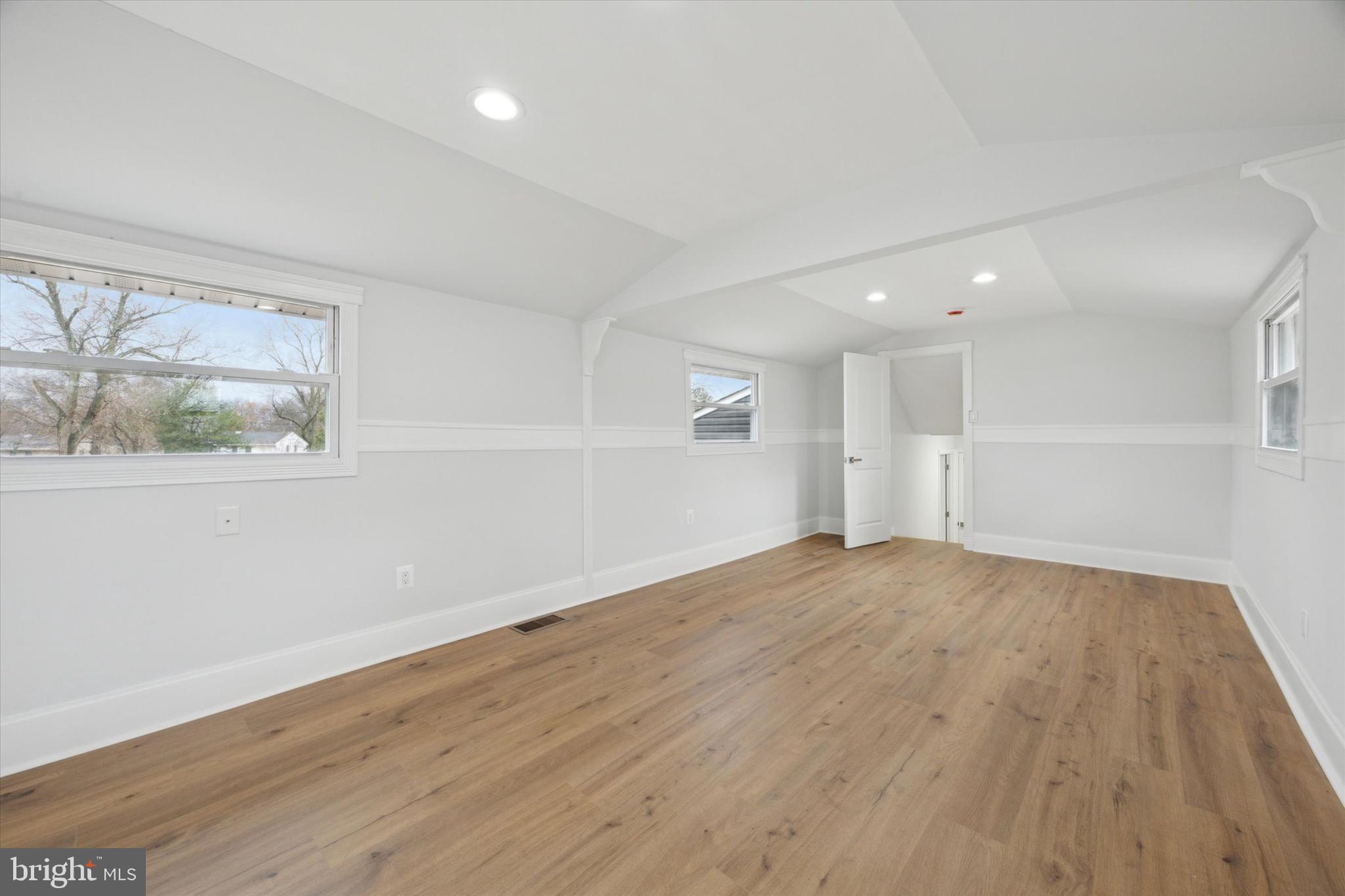 2124 Arleigh Road Cinnaminson, NJ 08077 - Photo 28 of 31 an empty room with wooden floor and windows