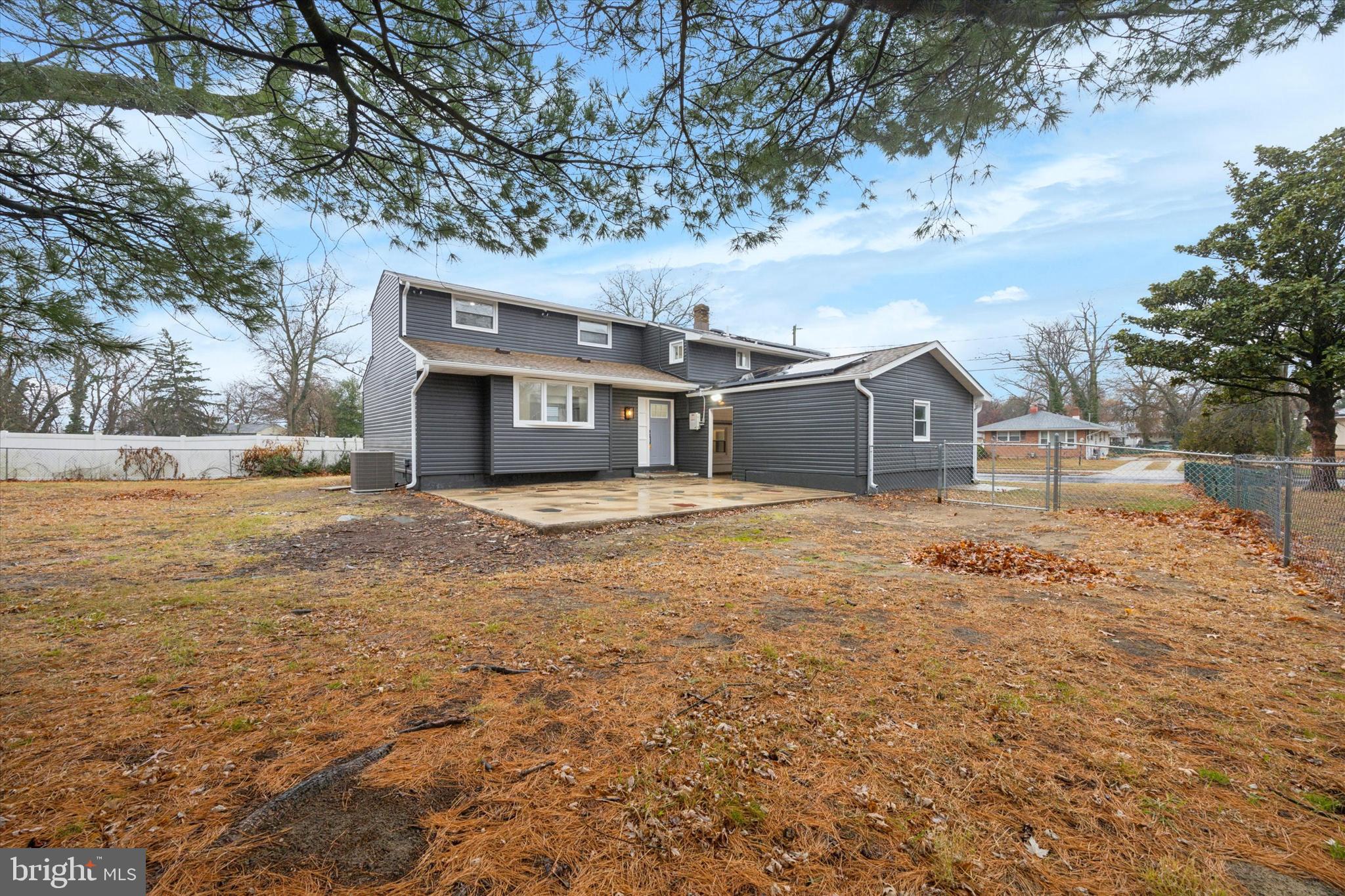 2124 Arleigh Road Cinnaminson, NJ 08077 - Photo 29 of 31 a front view of a house with a yard and large trees
