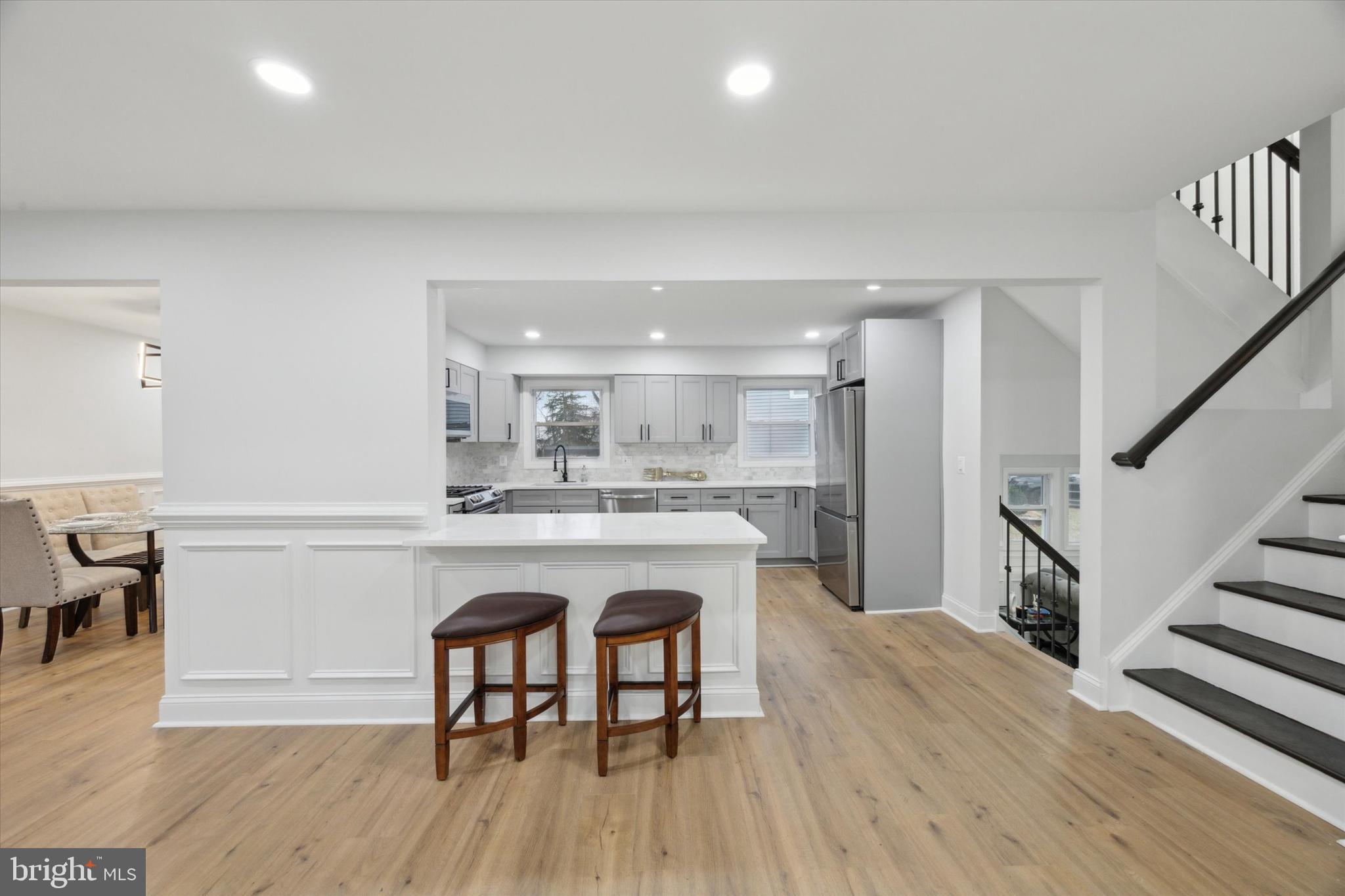 2124 Arleigh Road Cinnaminson, NJ 08077 - Photo 7 of 31 a living room with stainless steel appliances granite countertop furniture wooden floor and a kitchen view