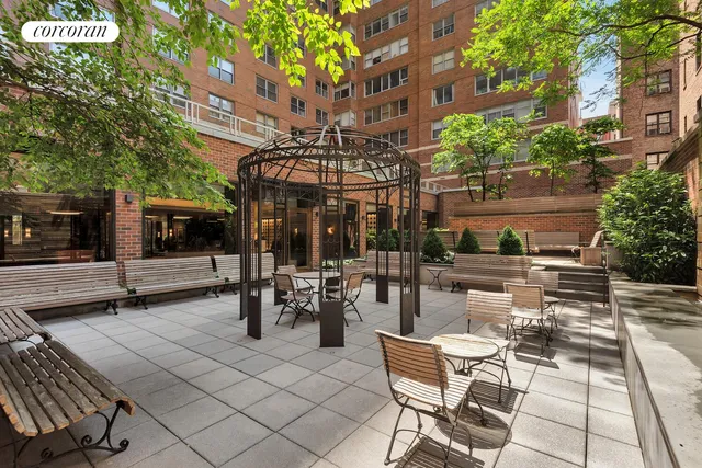 a view of a terrace with chairs and a table