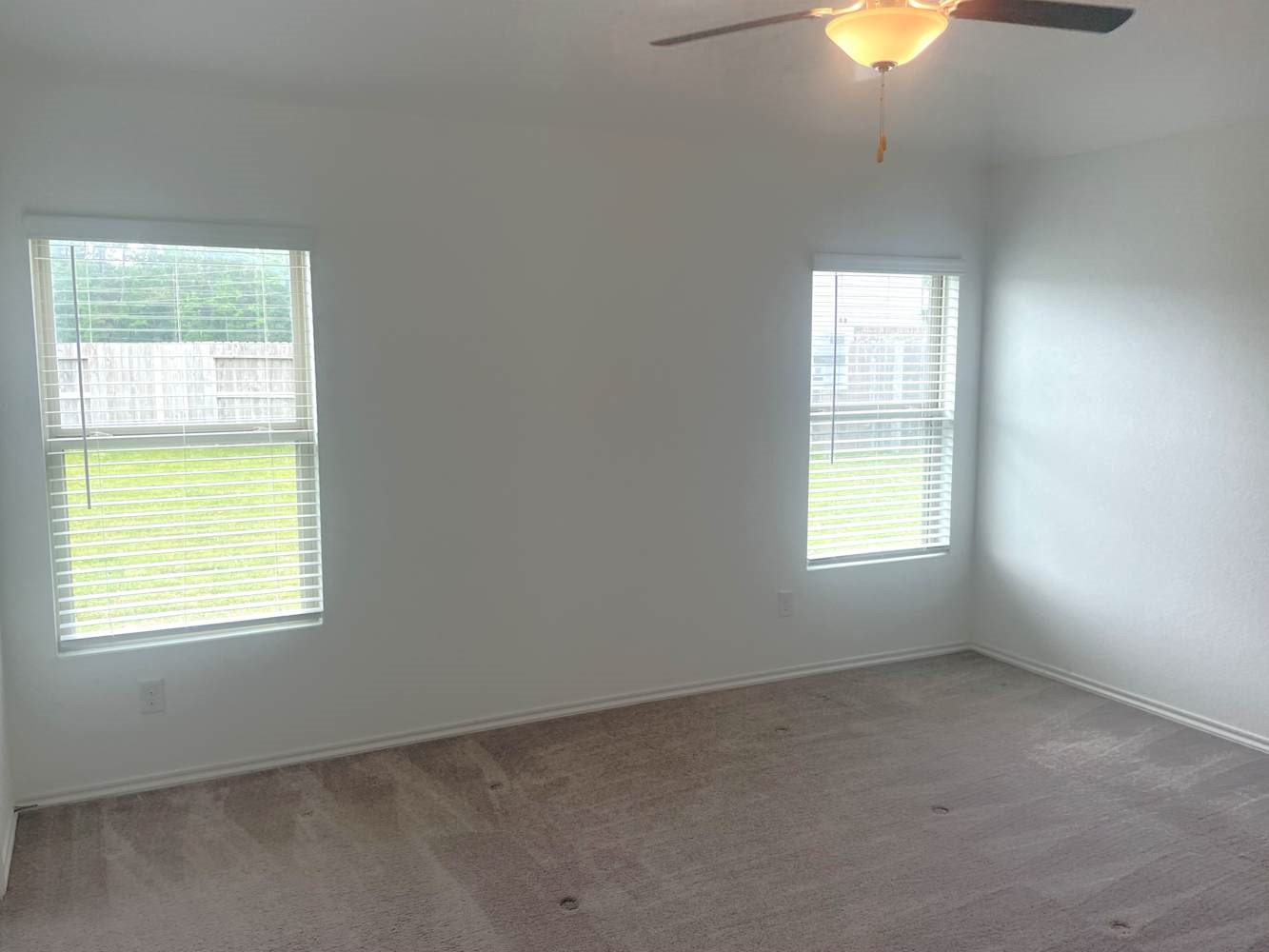 18788 Faustina Way New Caney, TX 77357 - Photo 4 of 9 a view of an empty room with a window