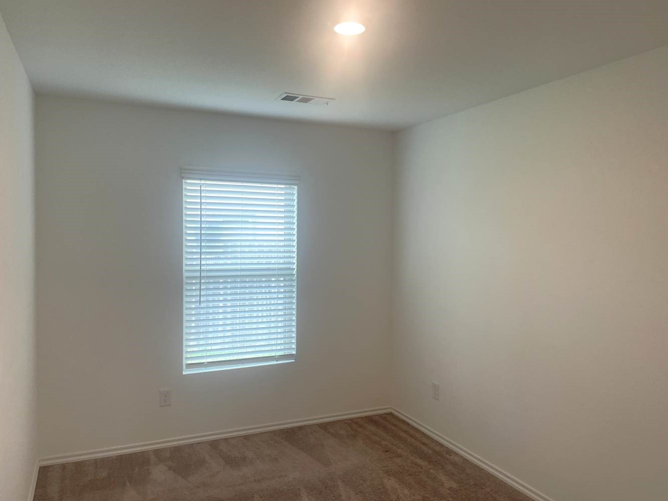 18788 Faustina Way New Caney, TX 77357 - Photo 5 of 9 an empty room with a window
