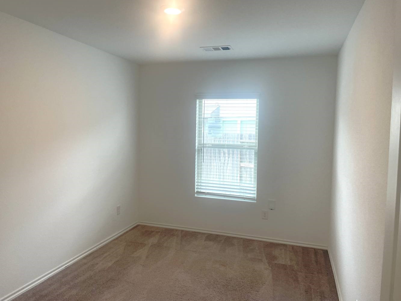18788 Faustina Way New Caney, TX 77357 - Photo 6 of 9 an empty room with a window