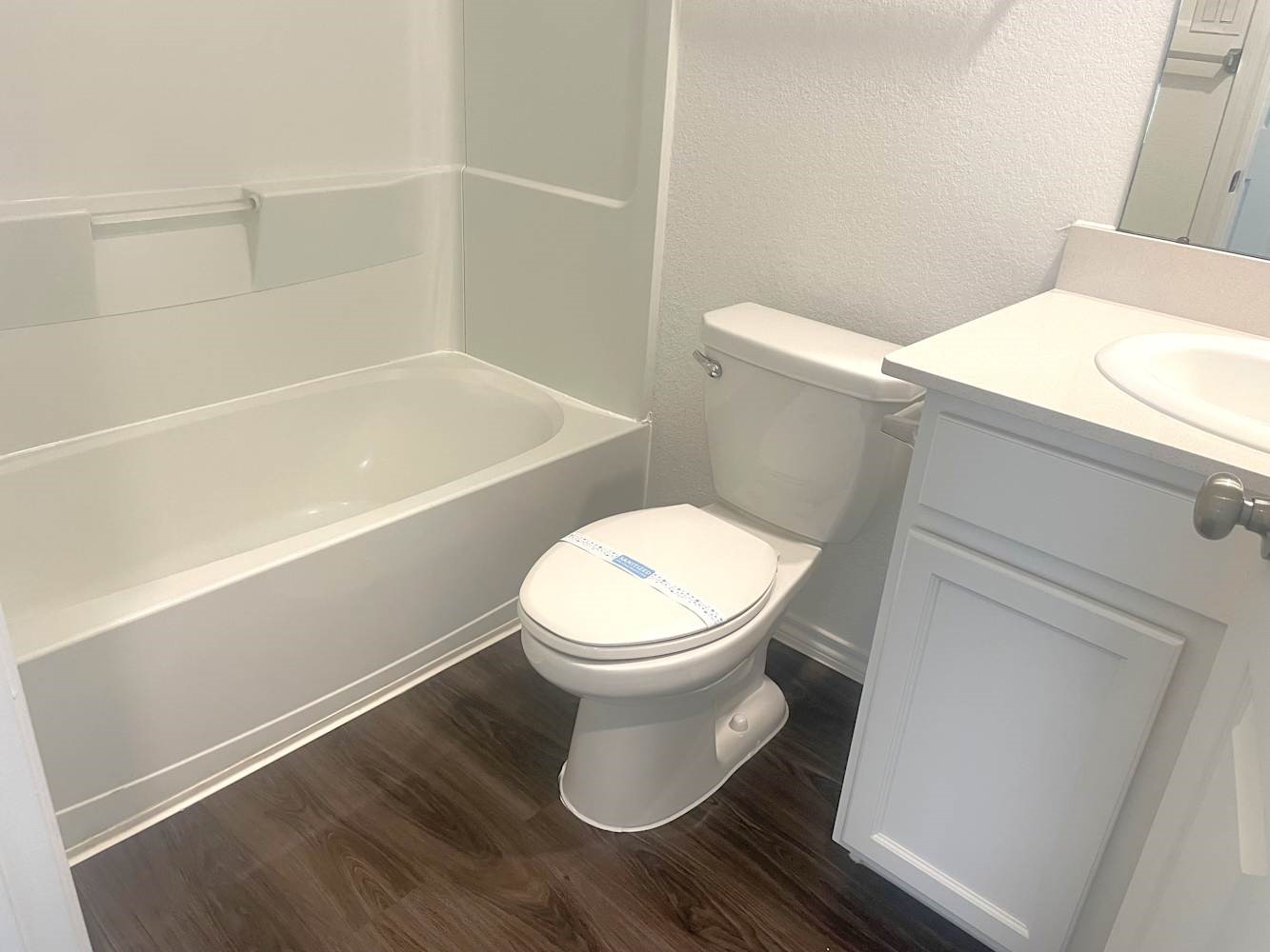 18788 Faustina Way New Caney, TX 77357 - Photo 8 of 9 a white toilet sitting next to a bath tub