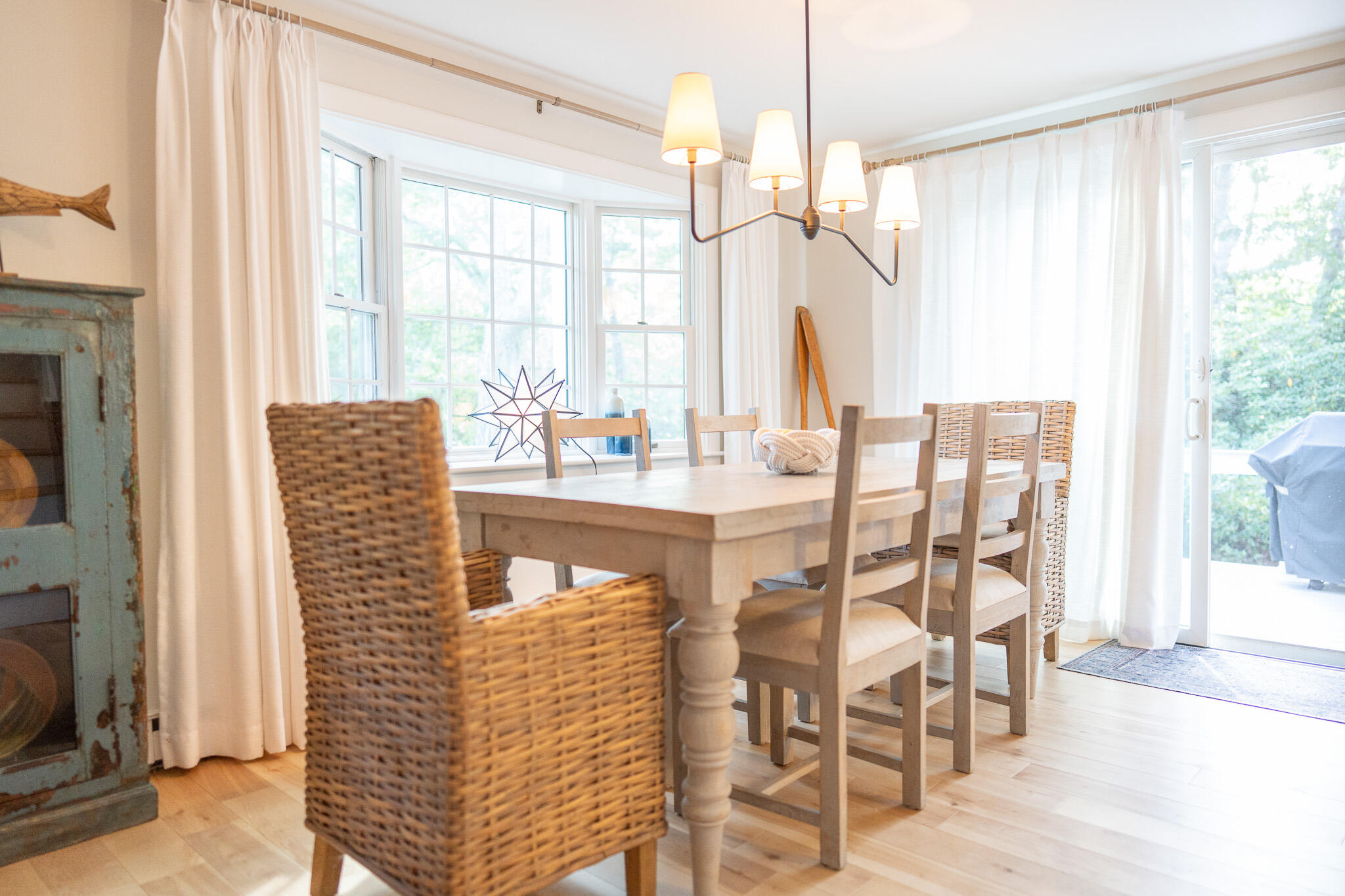 230 Massasoit Trail Eastham, MA 02642 - Photo 12 of 64 a dining room with furniture window and wooden floor