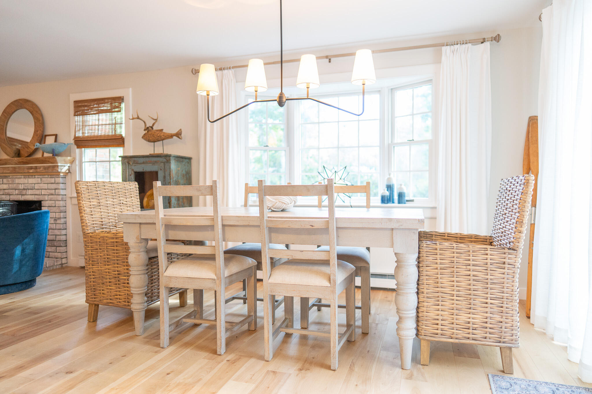 230 Massasoit Trail Eastham, MA 02642 - Photo 18 of 64 a dining room with furniture a chandelier and wooden floor