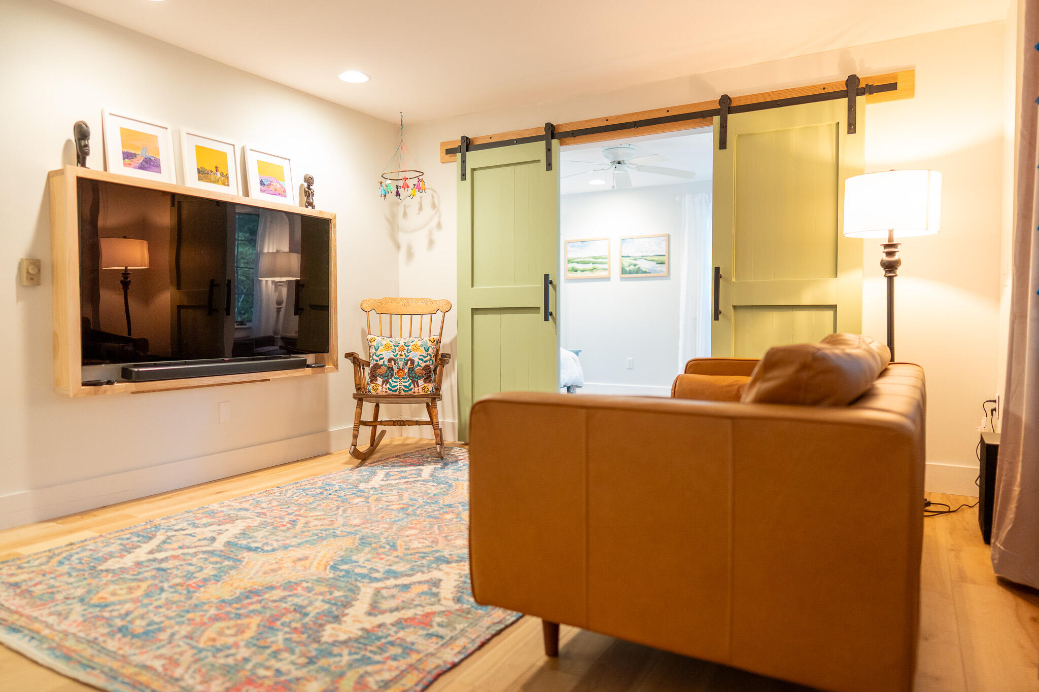 230 Massasoit Trail Eastham, MA 02642 - Photo 21 of 64 a living room with a couch and a flat screen tv