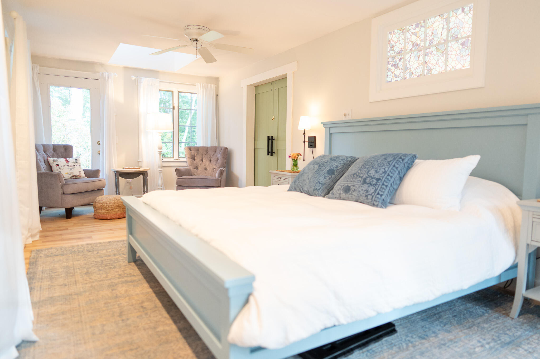 230 Massasoit Trail Eastham, MA 02642 - Photo 23 of 64 a spacious bedroom with a bed and a large window