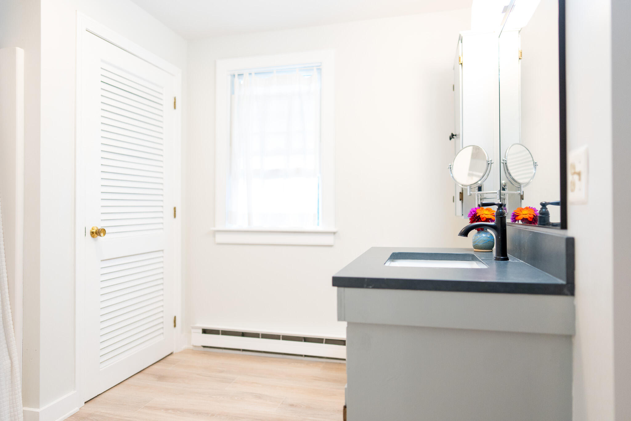 230 Massasoit Trail Eastham, MA 02642 - Photo 36 of 64 a bathroom with a sink and a mirror