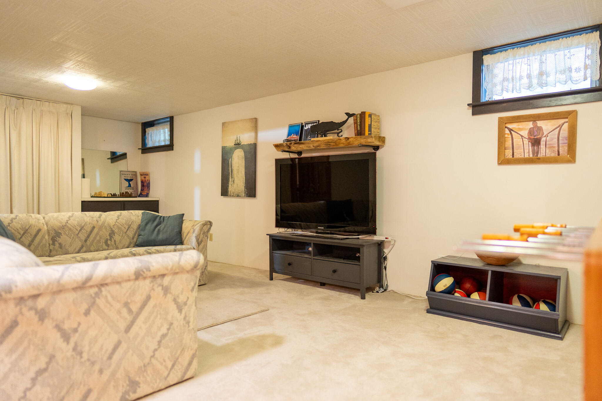 230 Massasoit Trail Eastham, MA 02642 - Photo 46 of 64 a living room with furniture and a flat screen tv