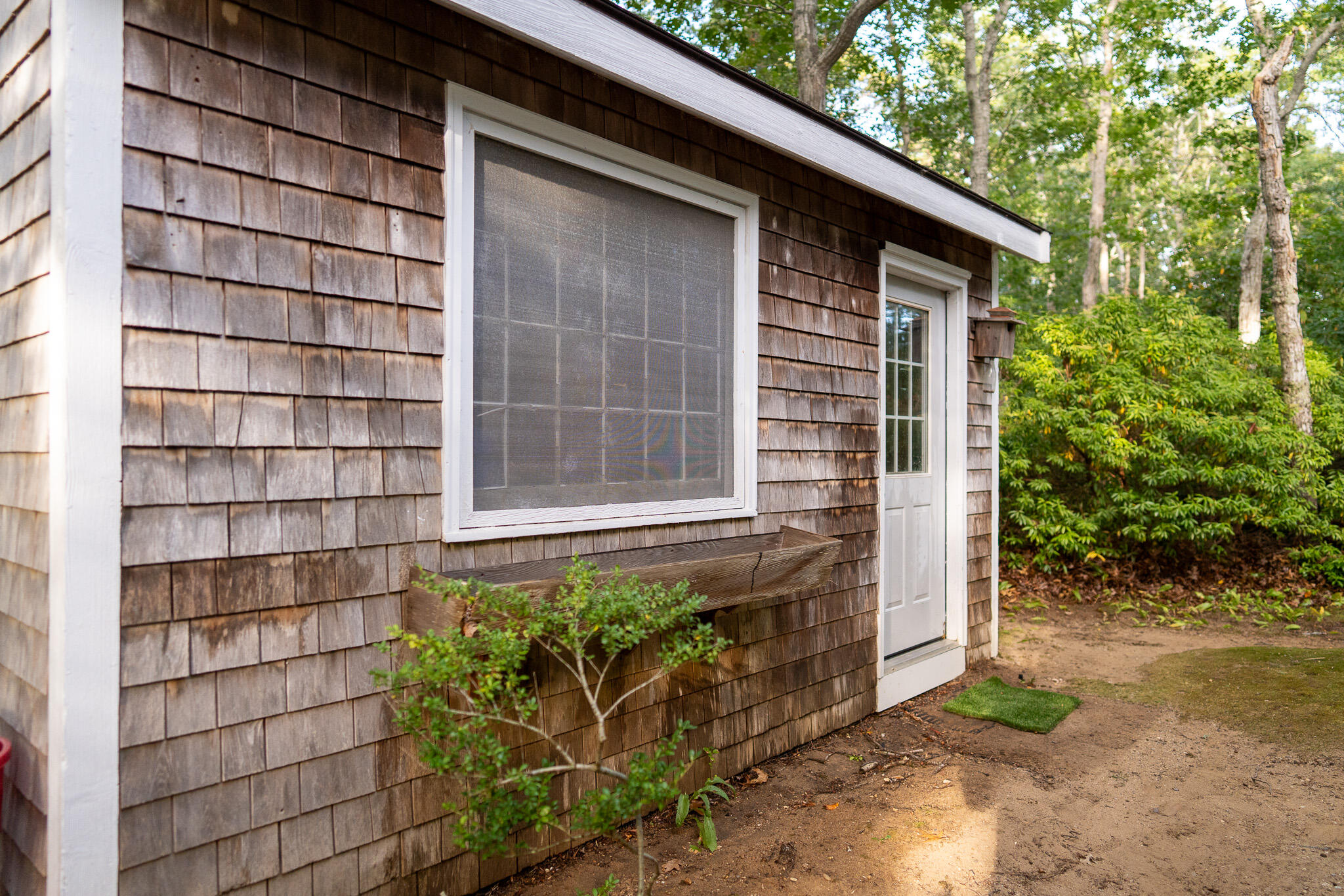 230 Massasoit Trail Eastham, MA 02642 - Photo 51 of 64 a front view of a house with a yard