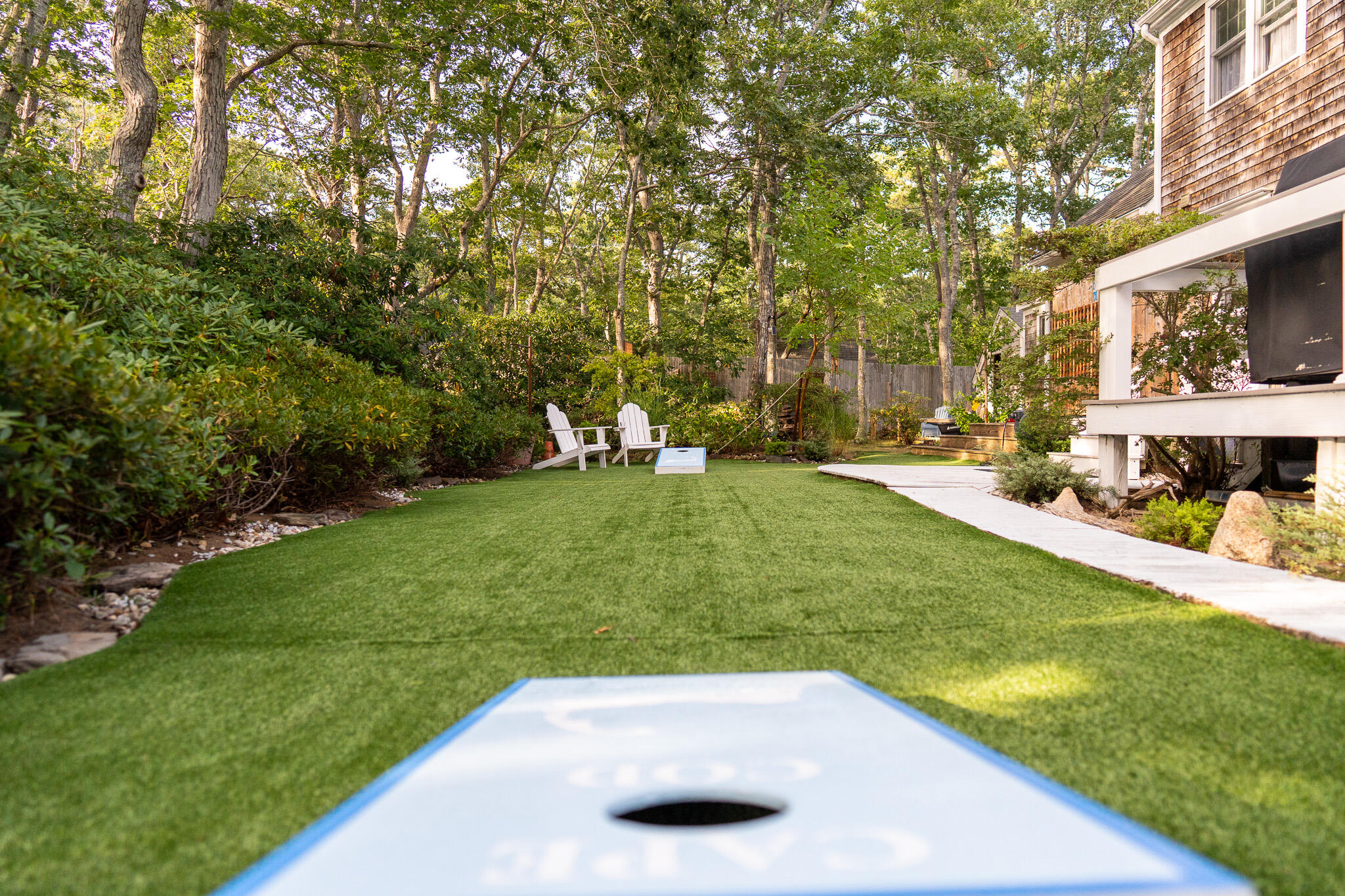230 Massasoit Trail Eastham, MA 02642 - Photo 53 of 64 a view of a backyard with a garden