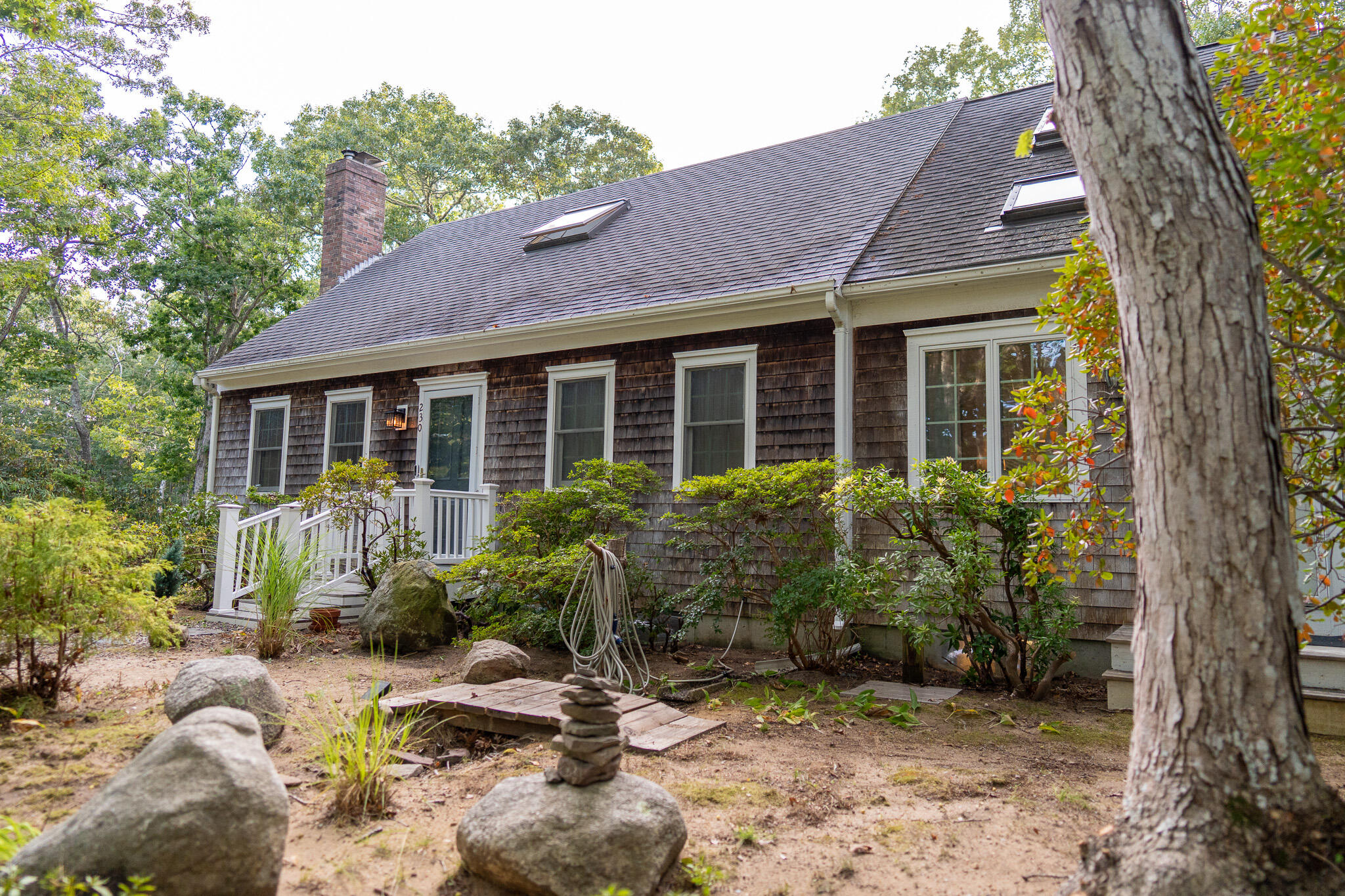 230 Massasoit Trail Eastham, MA 02642 - Photo 57 of 64 a view of a house with backyard and garden