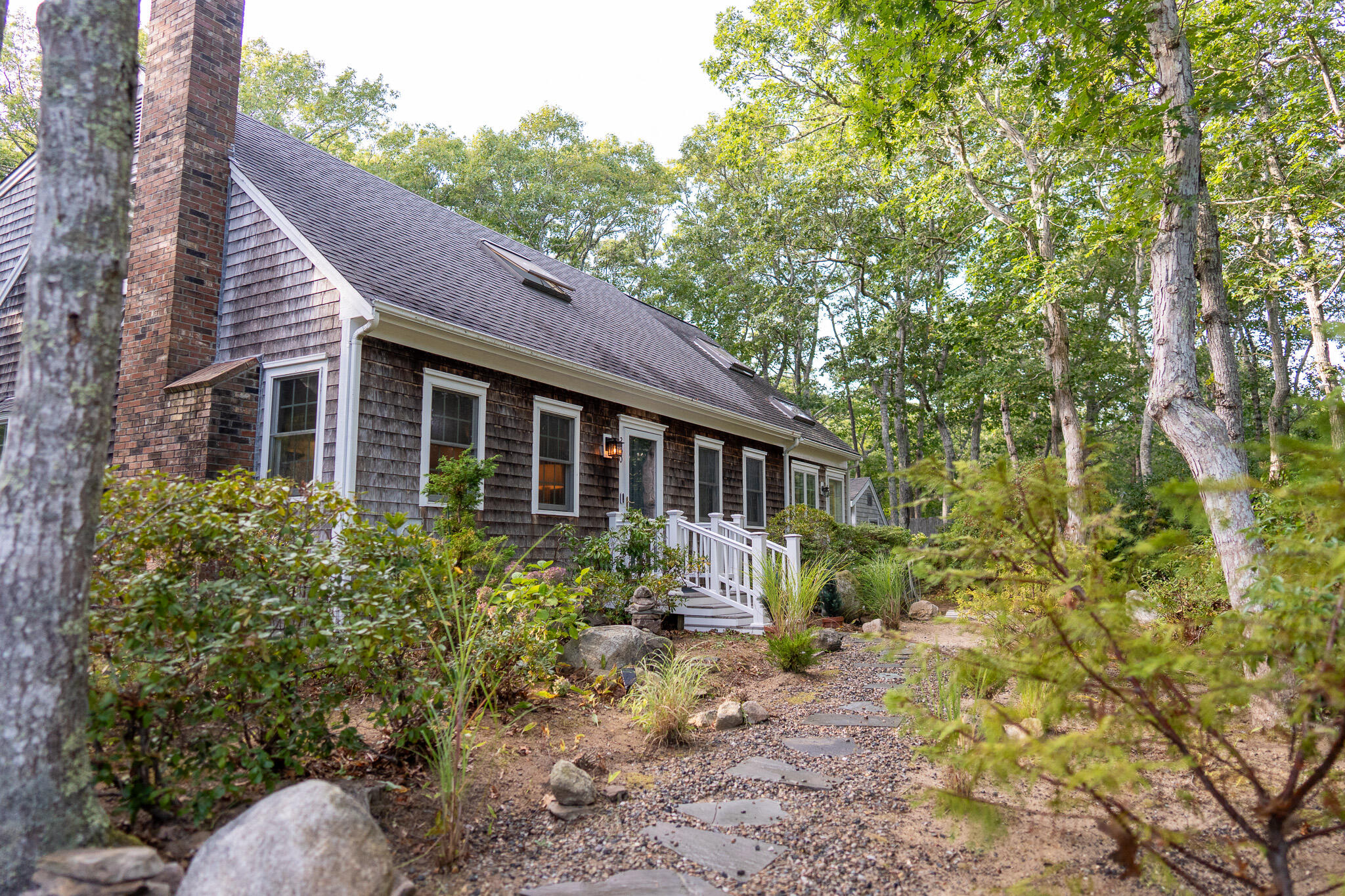 230 Massasoit Trail Eastham, MA 02642 - Photo 9 of 64 a view of a house with a yard