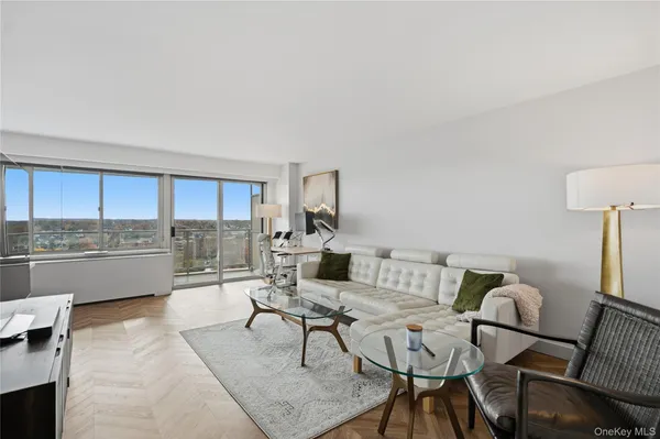 a living room with a couch and a view of living room