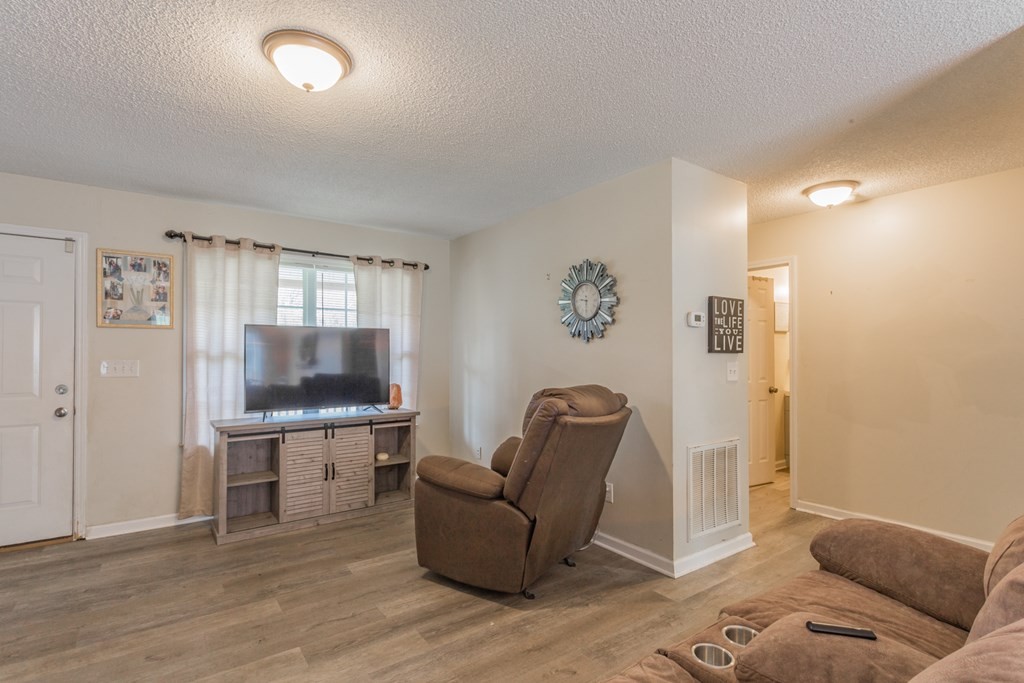 2322 Waring Road Northwest Dalton, GA 30721 - Photo 10 of 21 a living room with furniture and a flat screen tv