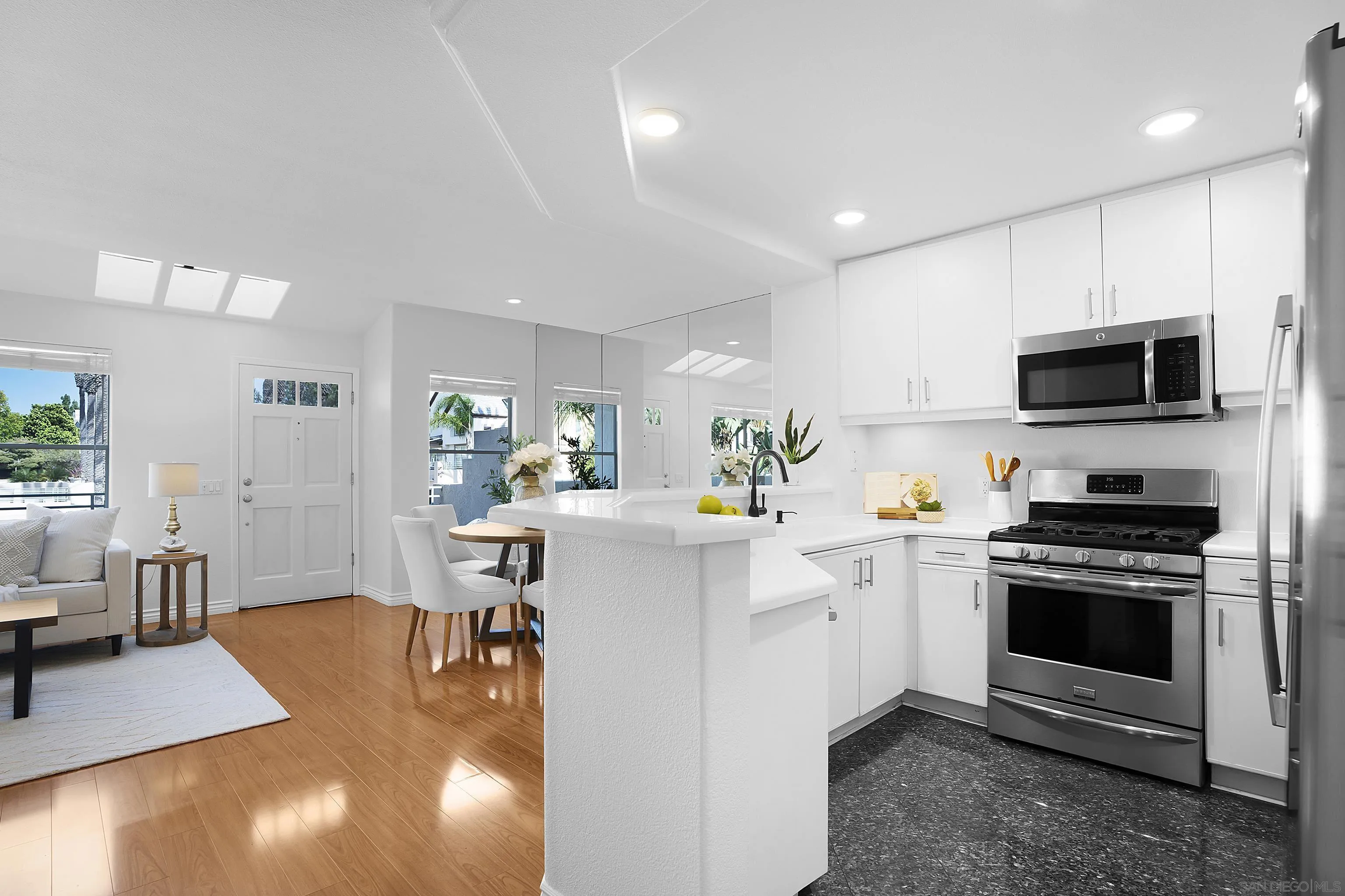 12646 Carmel Country Road, Unit 159 San Diego, CA 92130 - Photo 12 of 35 a kitchen with a sink a stove and cabinets