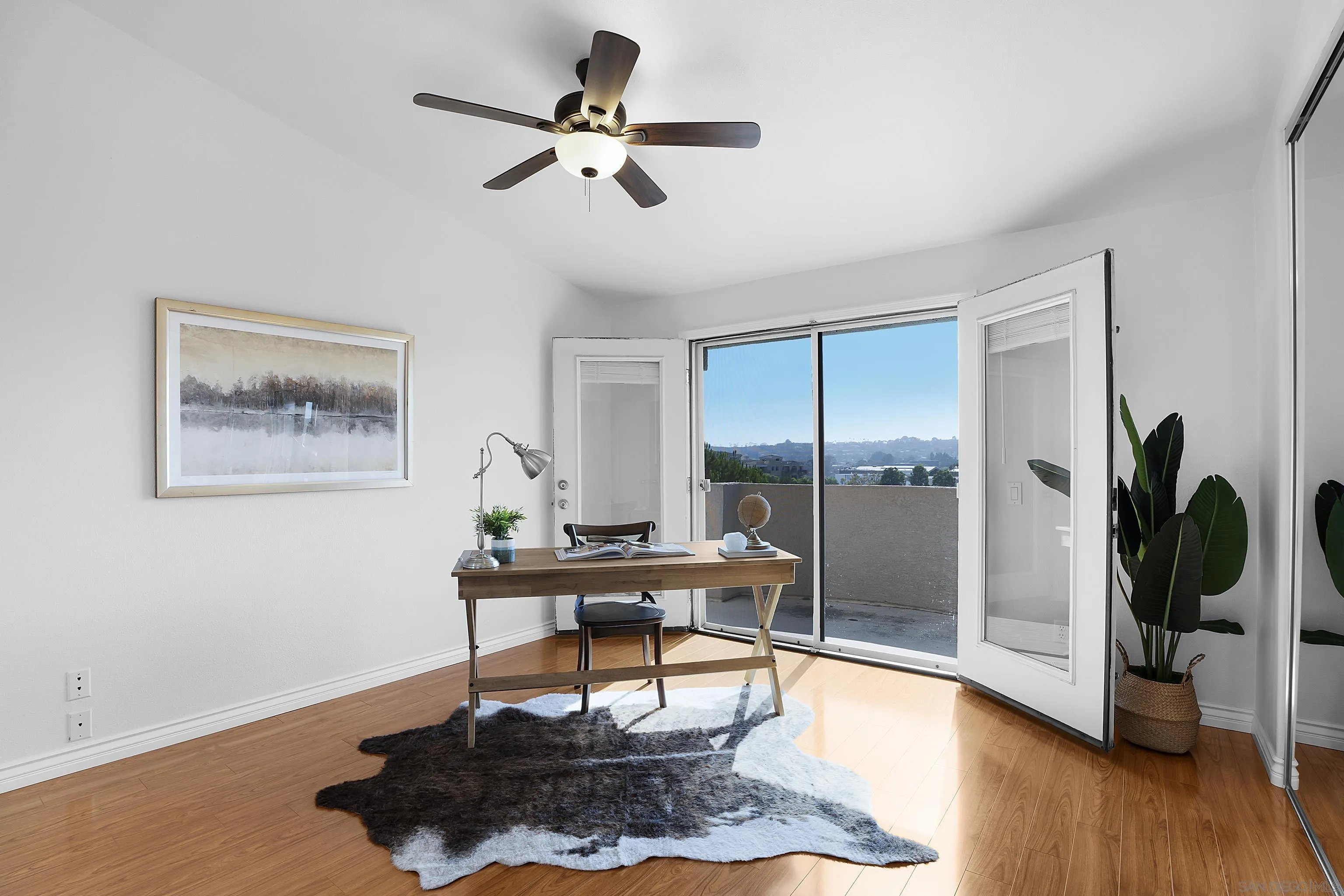 12646 Carmel Country Road, Unit 159 San Diego, CA 92130 - Photo 15 of 35 a work room with furniture and wooden floor