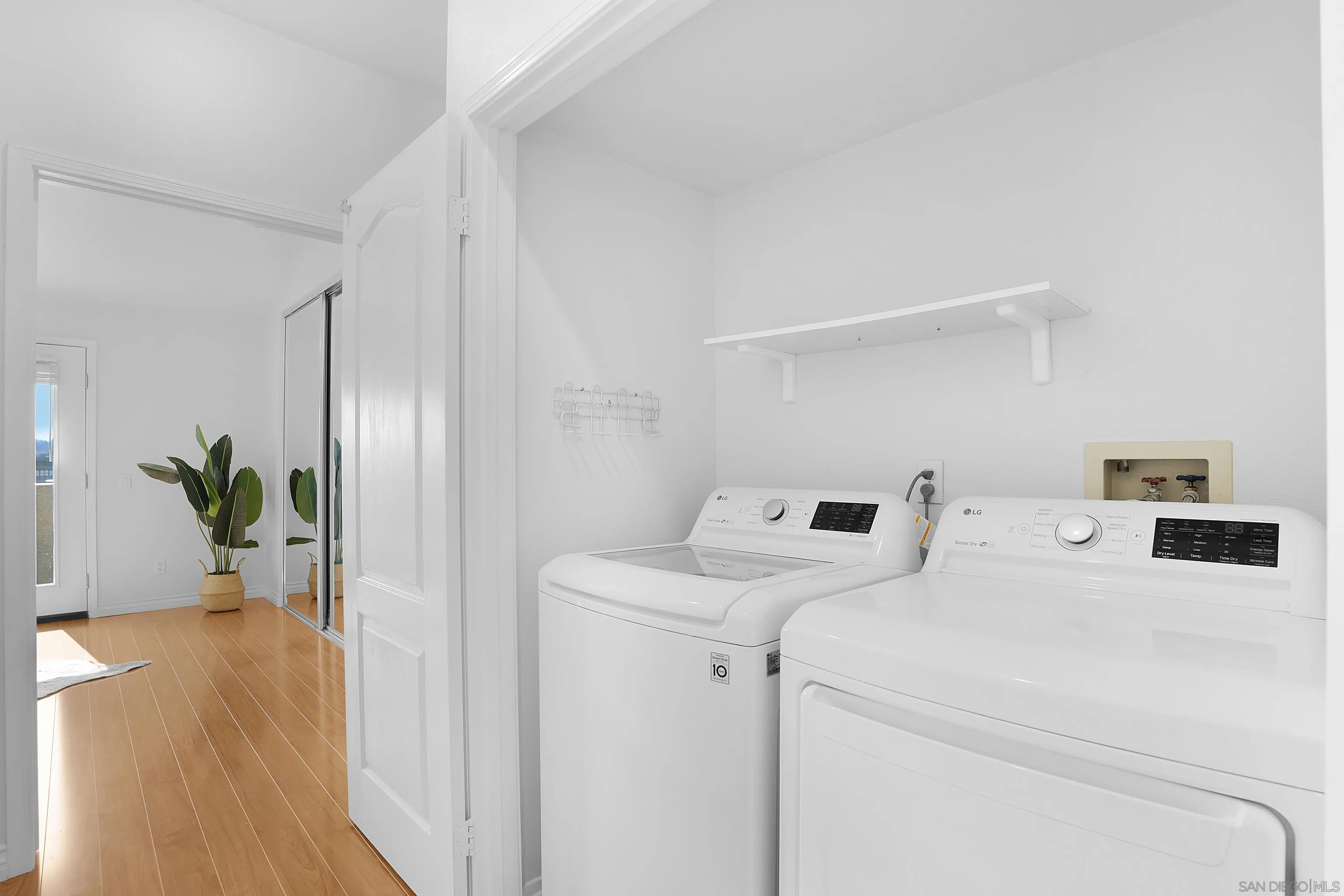 12646 Carmel Country Road, Unit 159 San Diego, CA 92130 - Photo 19 of 35 a view of storage and utility room with wooden floor