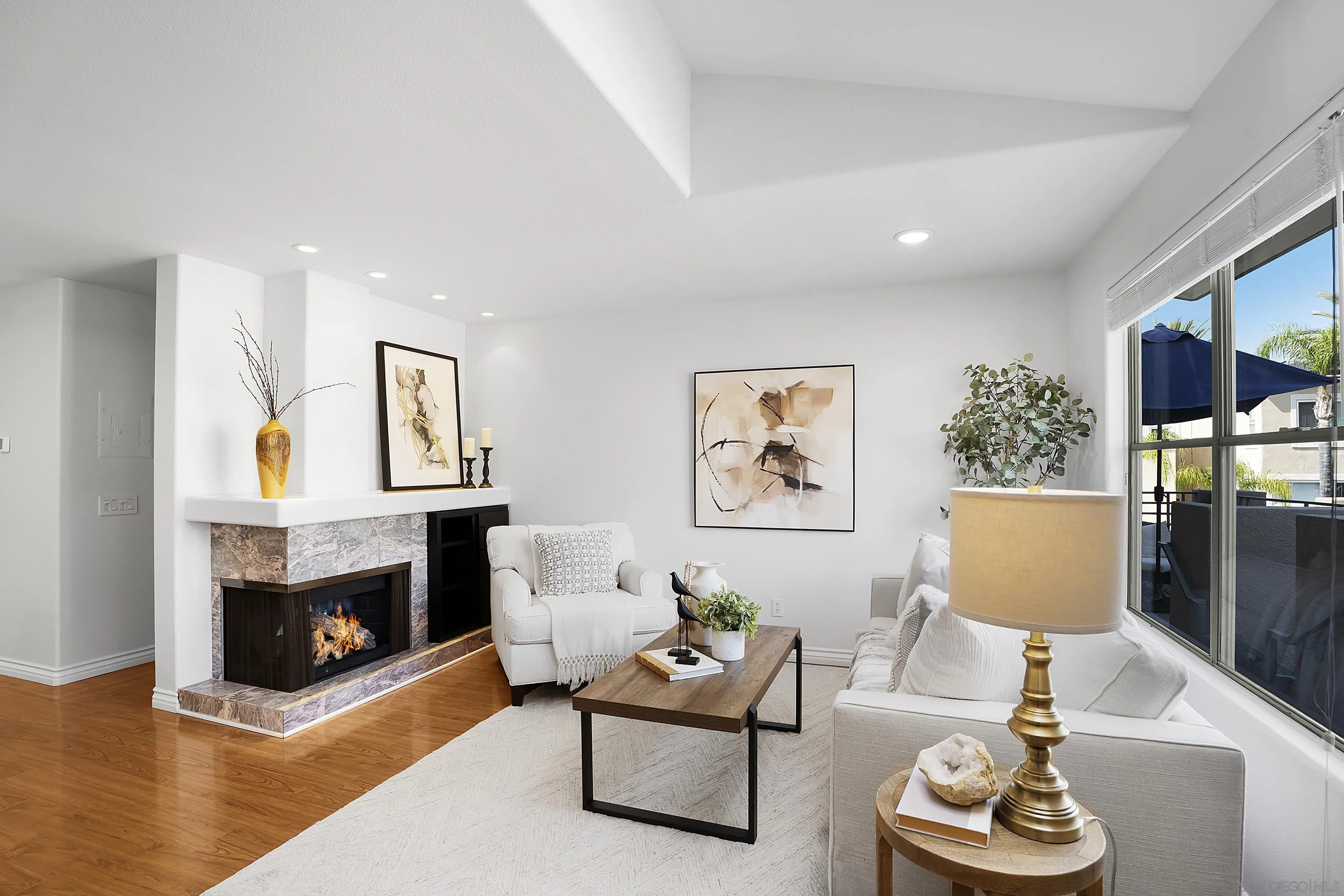 12646 Carmel Country Road, Unit 159 San Diego, CA 92130 - Photo 2 of 35 a living room with furniture a window and a fireplace