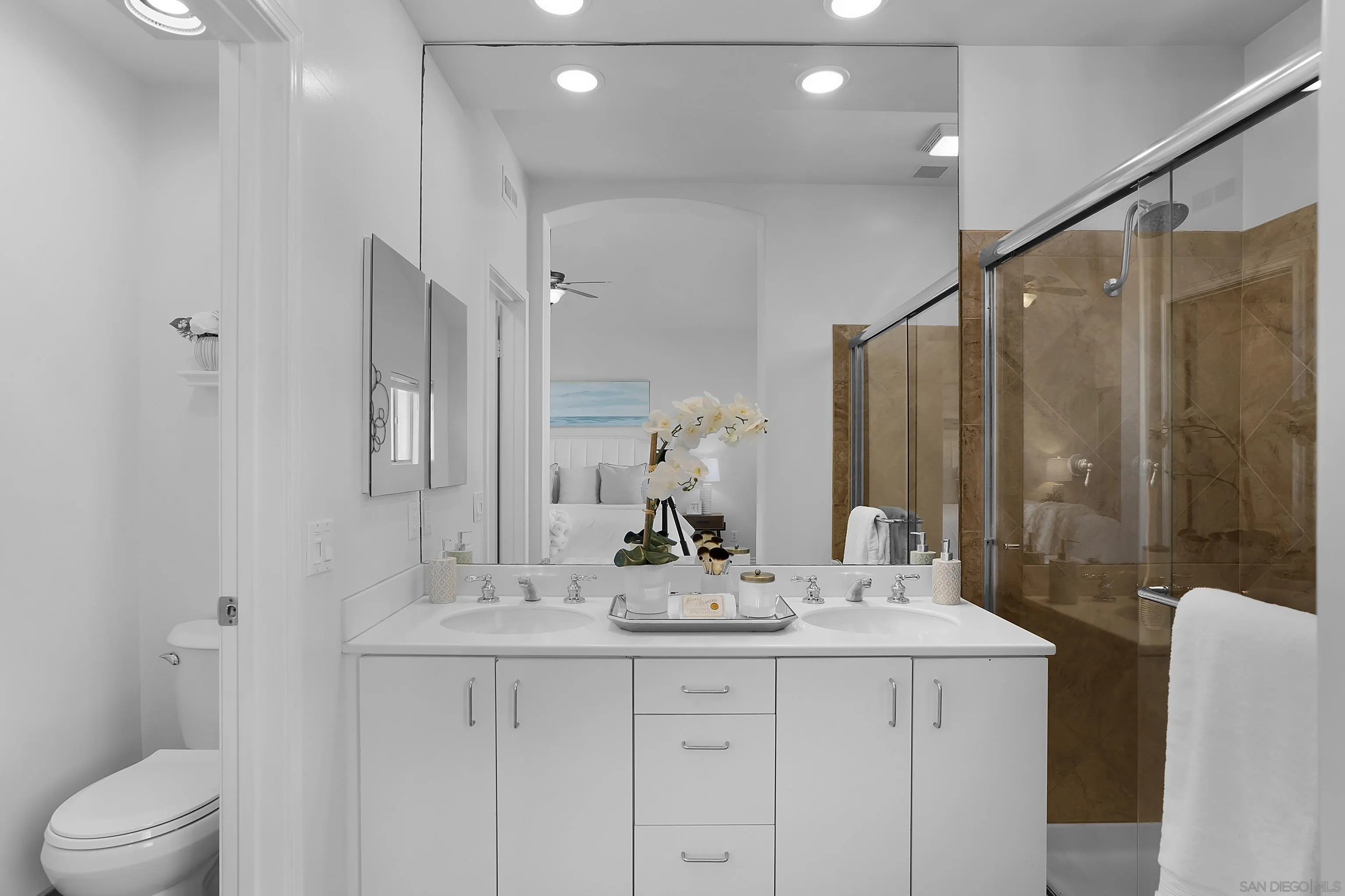 12646 Carmel Country Road, Unit 159 San Diego, CA 92130 - Photo 23 of 35 a bathroom with a double vanity sink mirror and toilet