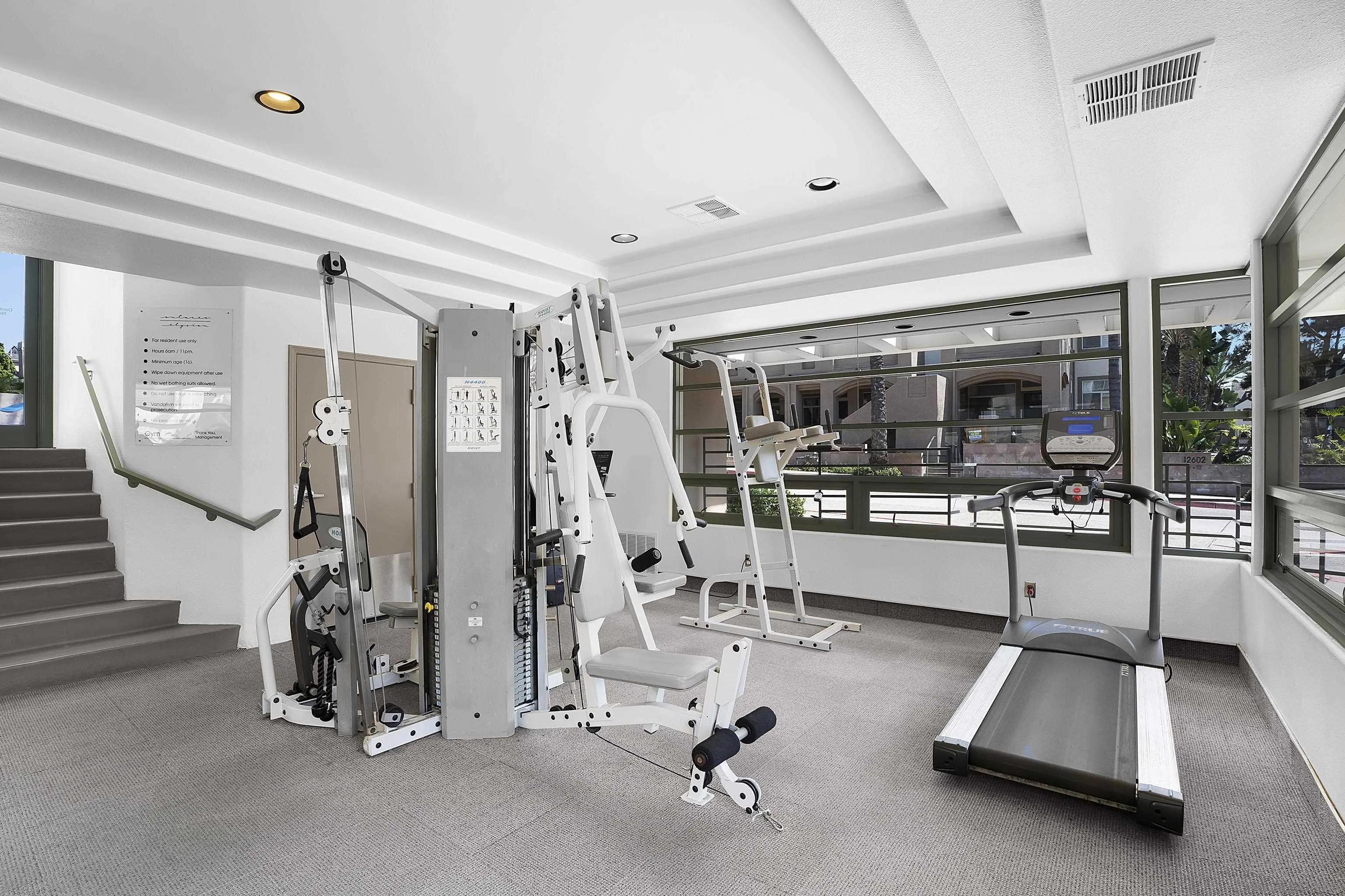 12646 Carmel Country Road, Unit 159 San Diego, CA 92130 - Photo 24 of 35 a room with gym equipment and white walls