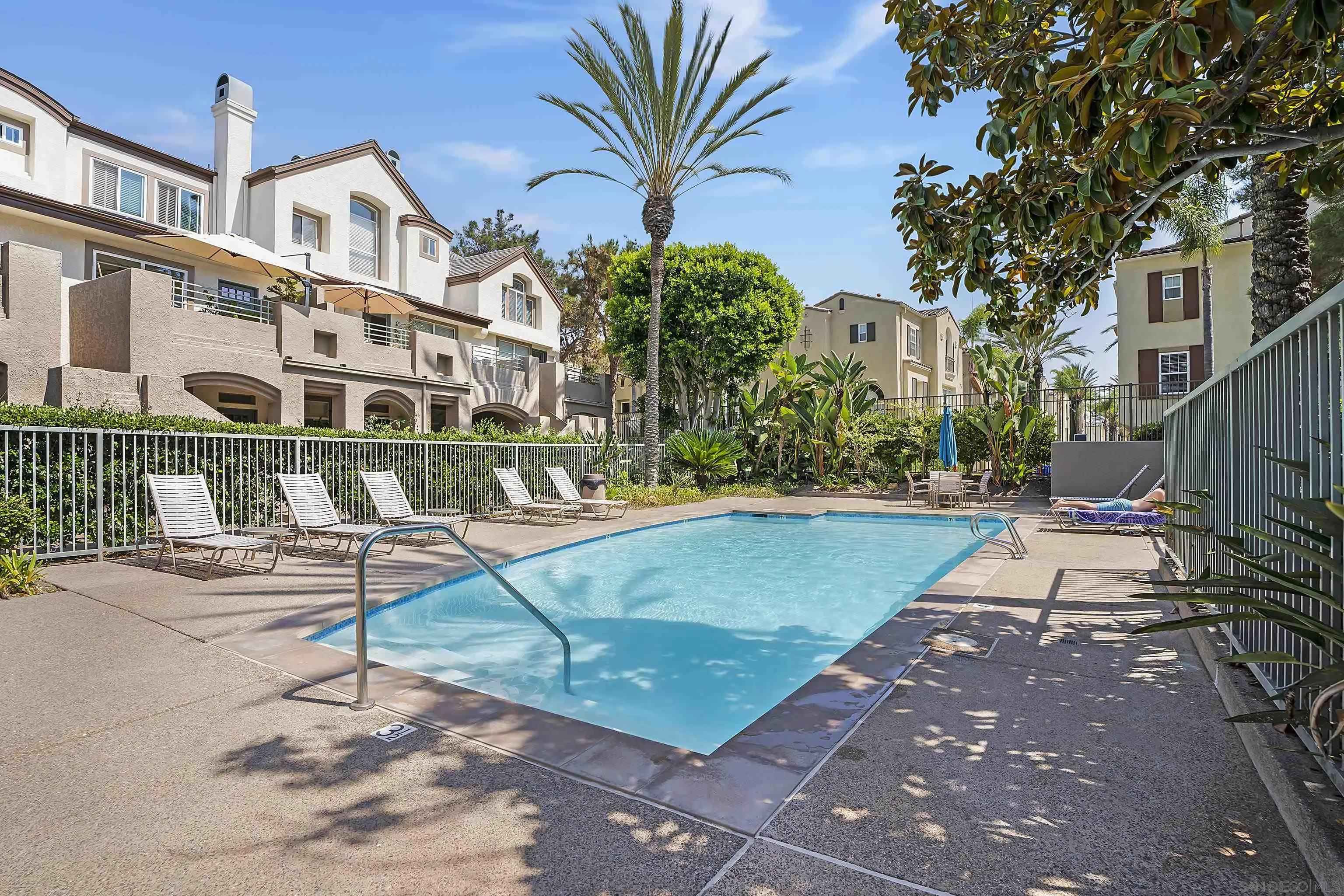 12646 Carmel Country Road, Unit 159 San Diego, CA 92130 - Photo 27 of 35 a view of a street with potted plants and large trees