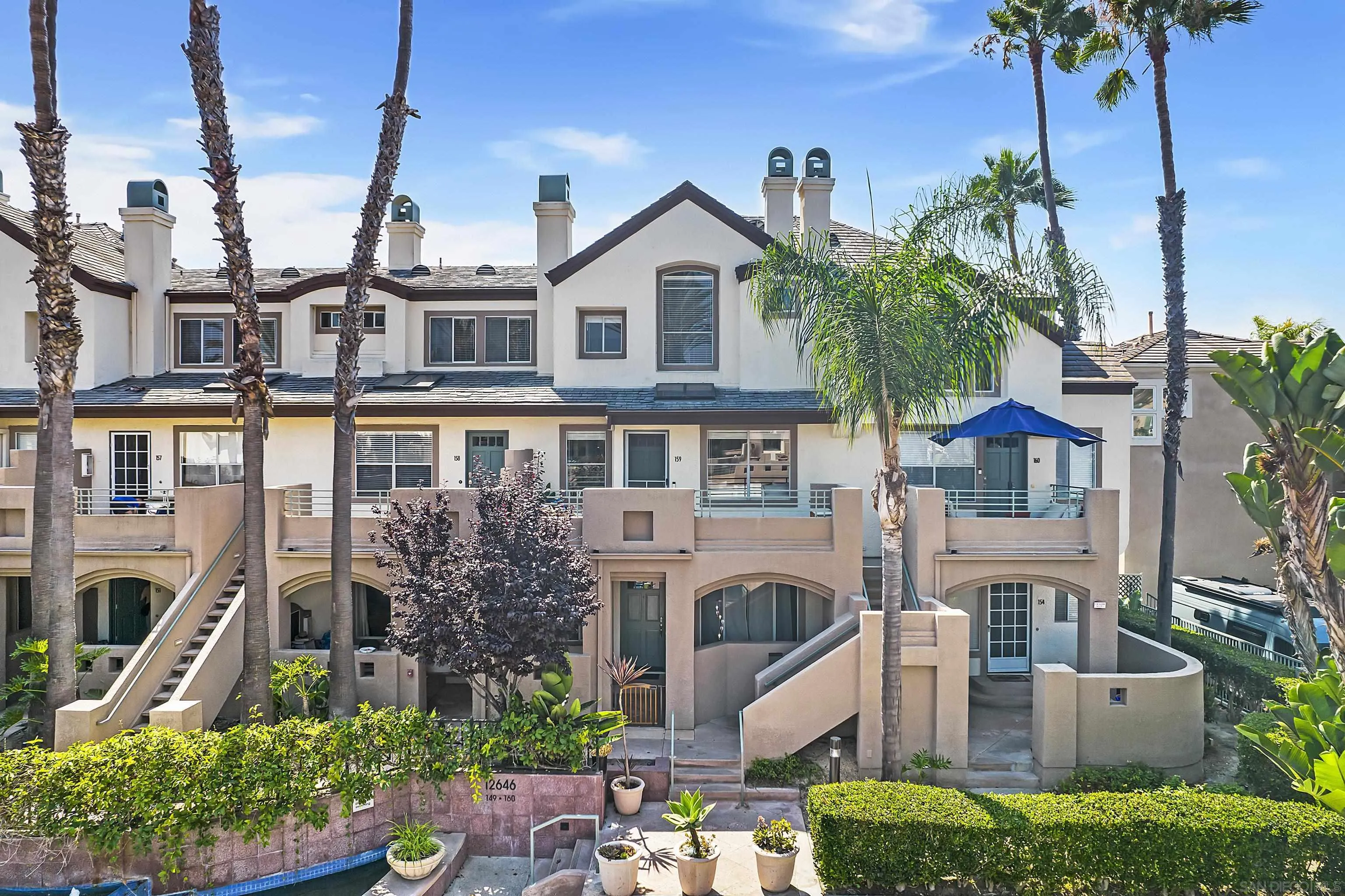 12646 Carmel Country Road, Unit 159 San Diego, CA 92130 - Photo 32 of 35 a front view of a house with garden