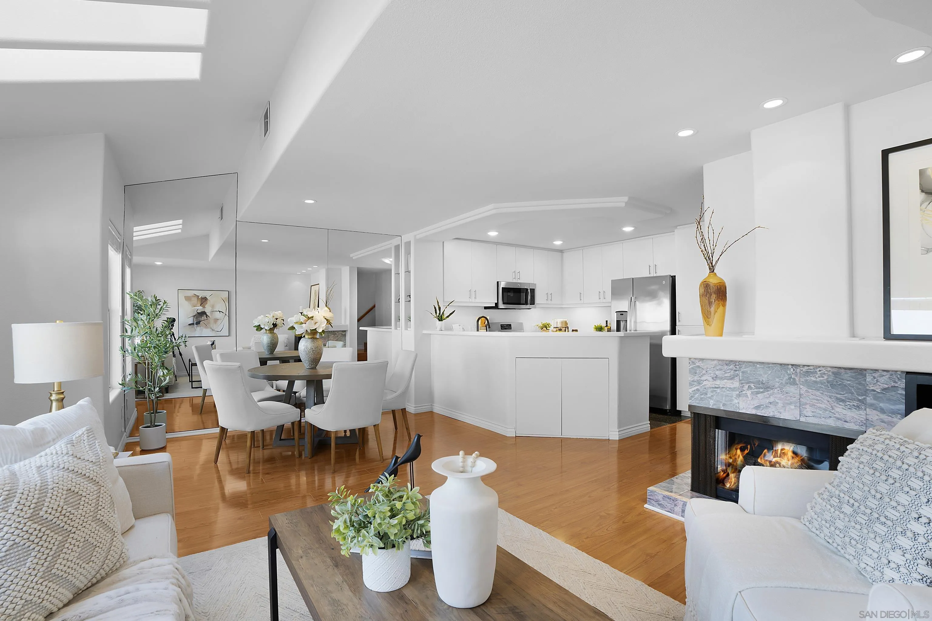 12646 Carmel Country Road, Unit 159 San Diego, CA 92130 - Photo 5 of 35 a living room with furniture wooden floor and a kitchen view