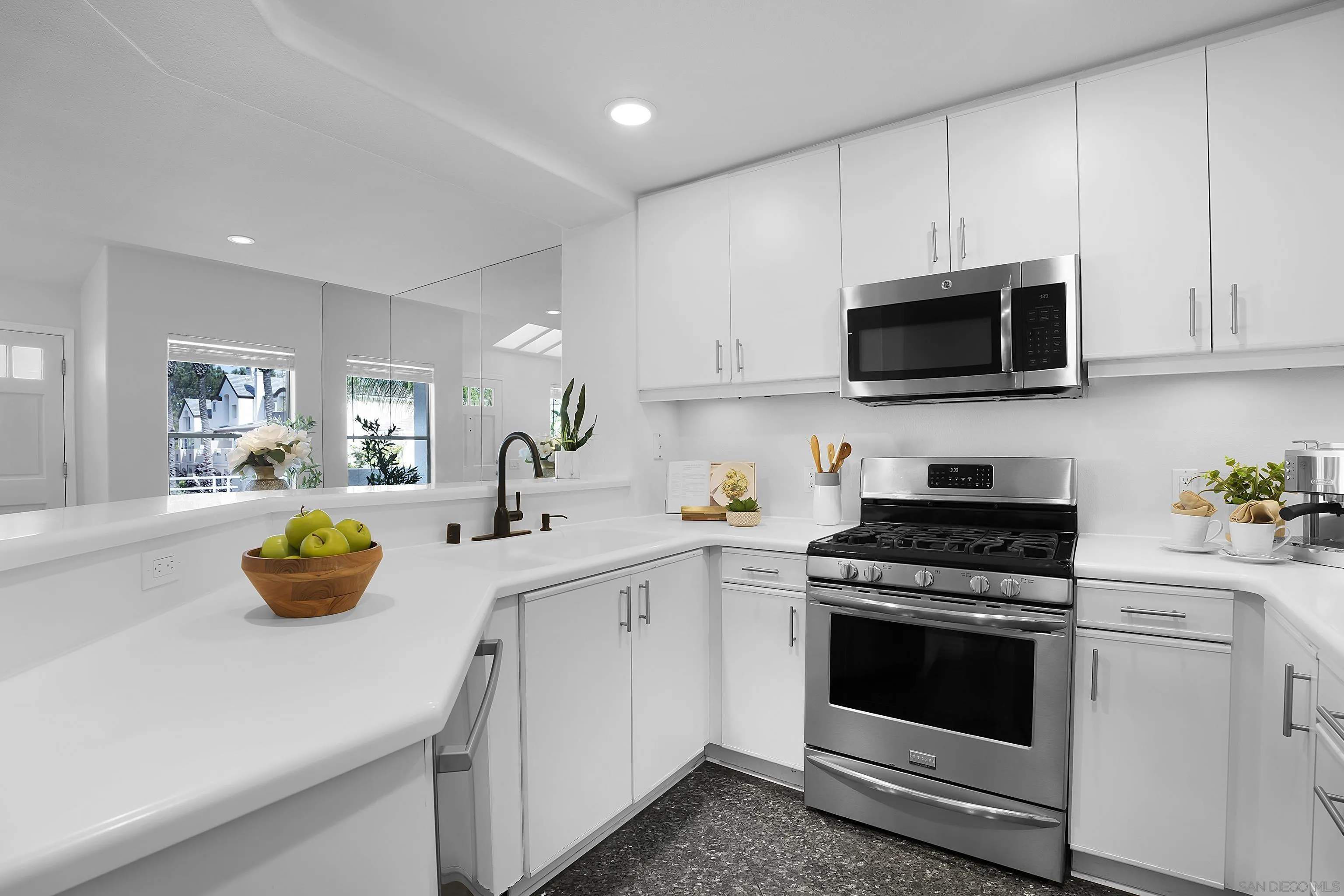 12646 Carmel Country Road, Unit 159 San Diego, CA 92130 - Photo 7 of 35 a kitchen with a sink and appliances in it