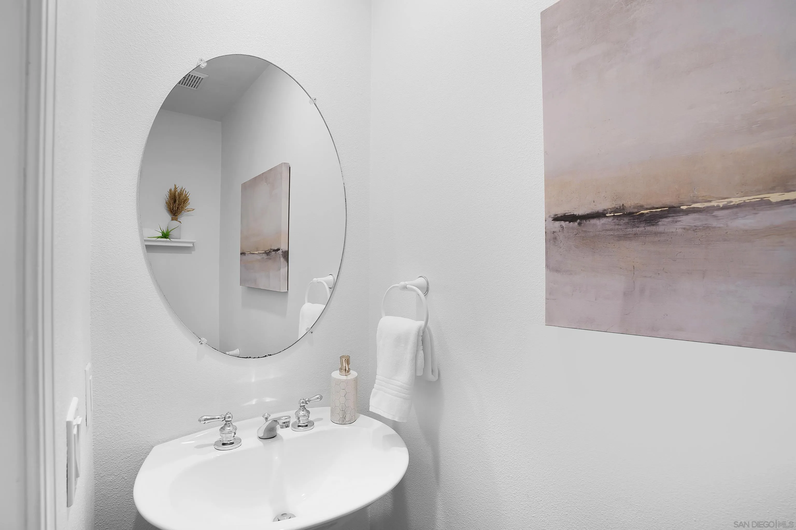 12646 Carmel Country Road, Unit 159 San Diego, CA 92130 - Photo 10 of 35 a bathroom with a sink and a mirror