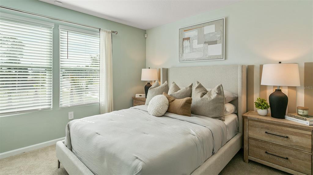 292 Palmetto Rdg Road St. Augustine, FL 32095 - Photo 12 of 37 a bedroom with a large bed and a window