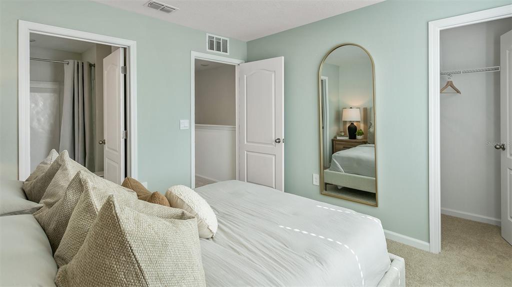 292 Palmetto Rdg Road St. Augustine, FL 32095 - Photo 14 of 37 a bedroom with a bed and a mirror