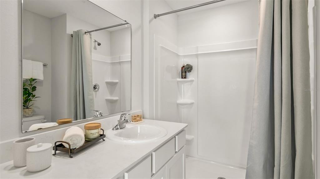 292 Palmetto Rdg Road St. Augustine, FL 32095 - Photo 15 of 37 a bathroom with a sink and a mirror