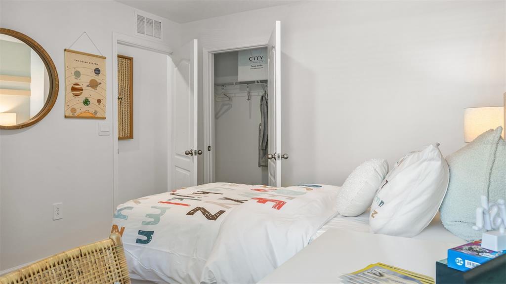 292 Palmetto Rdg Road St. Augustine, FL 32095 - Photo 21 of 37 a bedroom with a bed and a mirror