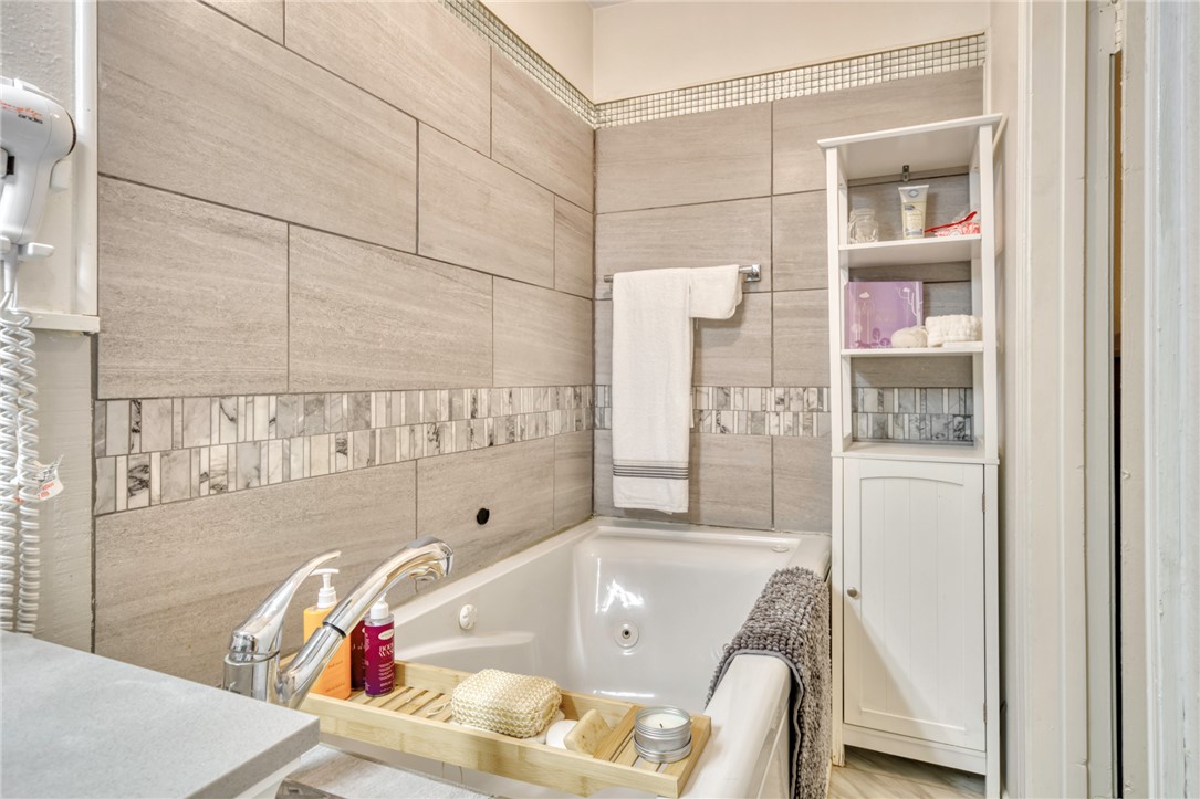 1681 Union Road Madisonville, TX 77864 - Photo 20 of 50 a bathroom with a tub and a shower