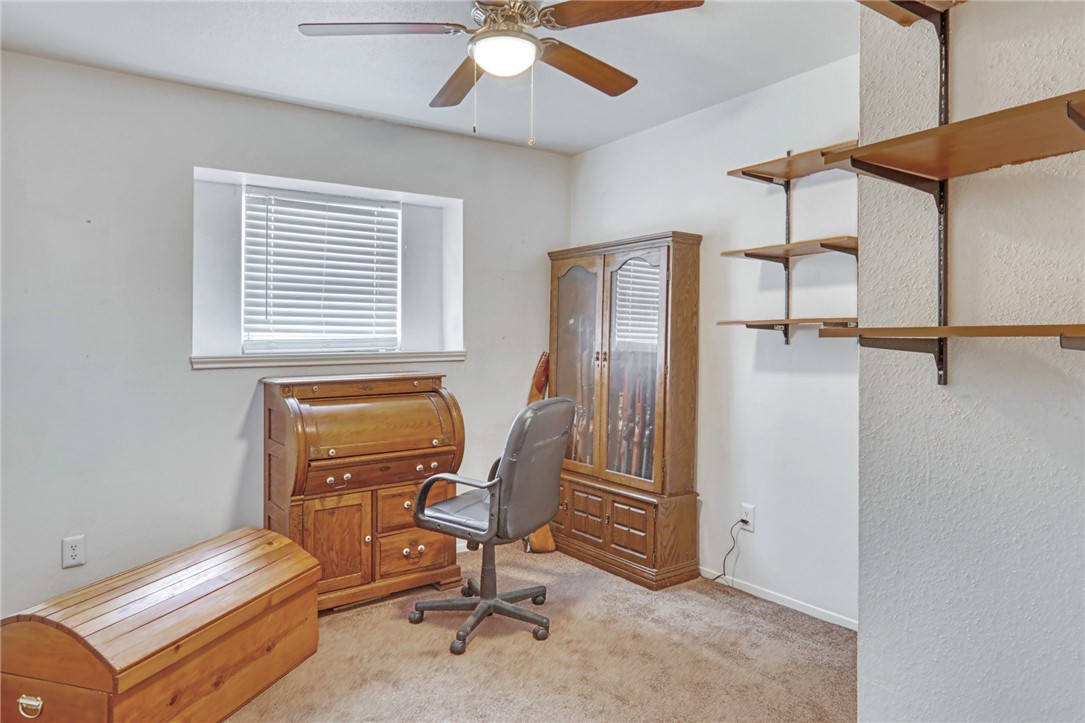 1681 Union Road Madisonville, TX 77864 - Photo 25 of 50 a view of a workspace with furniture and a window