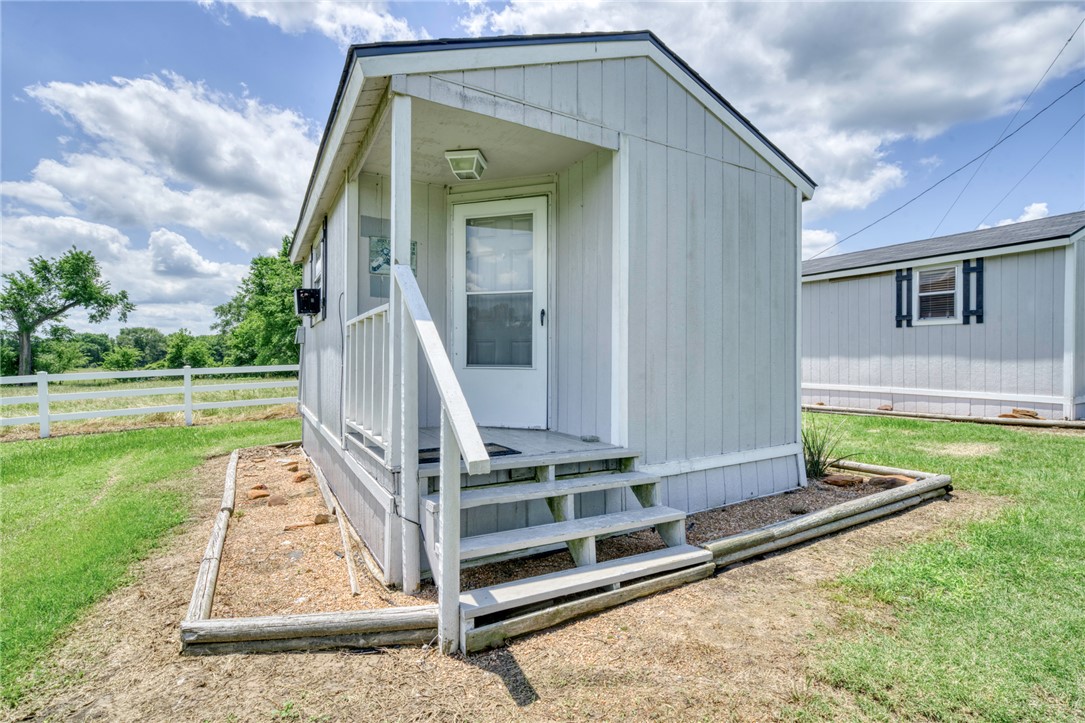 1681 Union Road Madisonville, TX 77864 - Photo 30 of 50 a front view of a house with a yard