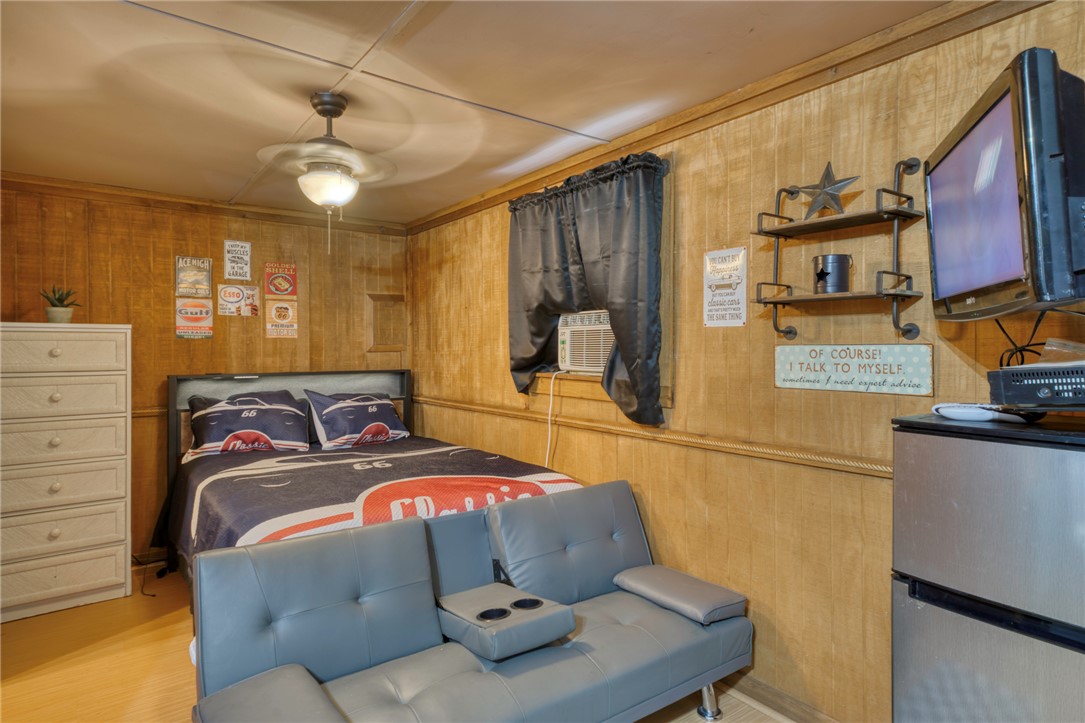 1681 Union Road Madisonville, TX 77864 - Photo 34 of 50 a bedroom with a bed and wooden cabinets