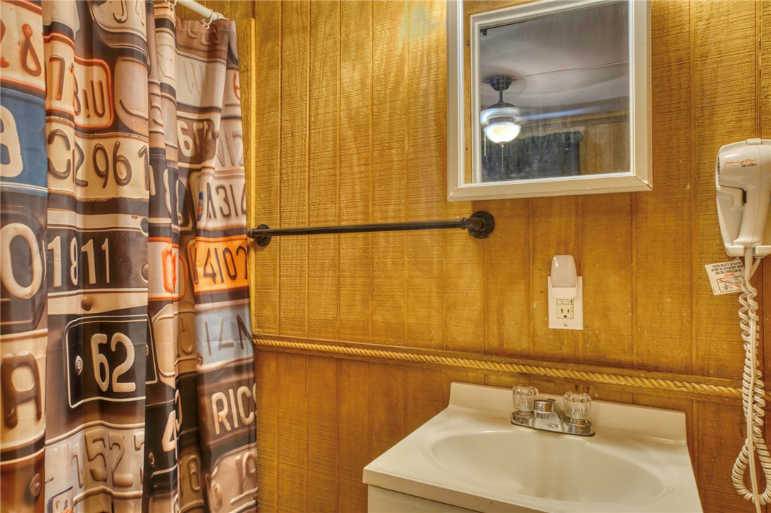 1681 Union Road Madisonville, TX 77864 - Photo 36 of 50 a bathroom with a sink and a mirror