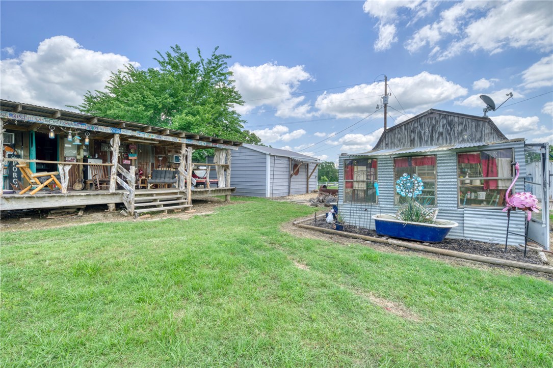 1681 Union Road Madisonville, TX 77864 - Photo 39 of 50 a view of a house with patio and a yard