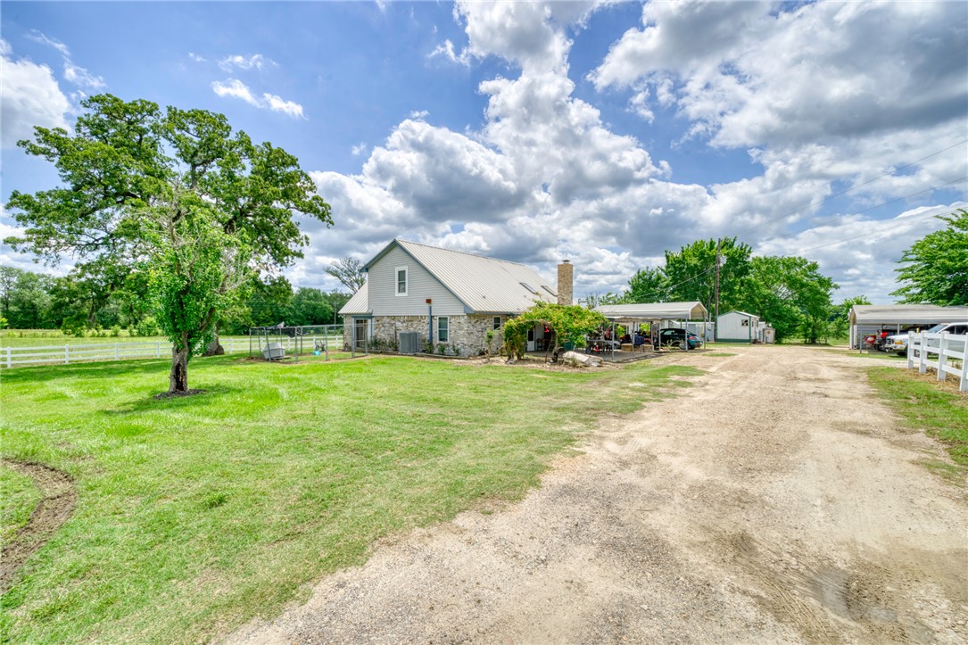 1681 Union Road Madisonville, TX 77864 - Photo 4 of 50 a front view of a house with a yard